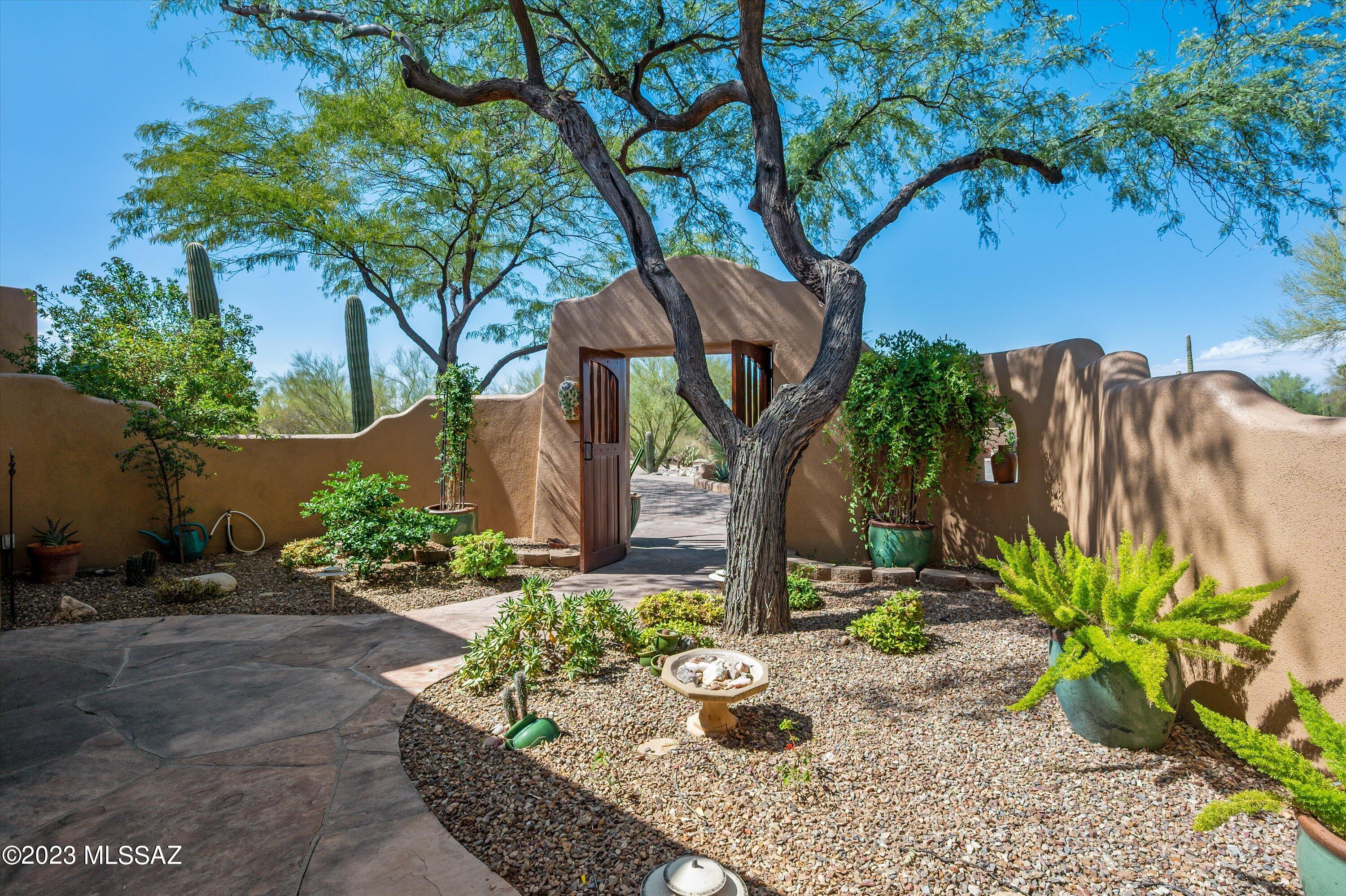 Perfectly nestled at the end of a serene cul-de-sac in the highly desirable and premium neighborhood of Shadow Hills!  As you step inside, you'll be greeted by the expansive great room bathed in natural light, adorned with stunning niches, and a cozy gas fireplace that creates a truly welcoming atmosphere. You'll immediately notice the pride of ownership throughout the property. The current owners have spared no effort in maintaining and enhancing this residence. Step outside through one of the multiple access points to a backyard carefully designed for both relaxation and entertainment, making it the perfect place to unwind or host gatherings. The primary bathroom exudes a spa-like ambiance with its luxurious features, including a deep jetted tub, a spacious shower, dual sinks, and a separate second vanity. This remarkable property features a 3-car garage with a workbench area equipped with an evaporative cooler to keep you and your vehicles cool during the summer months. Storage space abounds, making organization a breeze. Plenty of extra features throughout, including iron security screen doors, 2 newer Trane HVACs, exterior paint, Kinetico water softener, alarm system, tankless water heater, SONOS sound system, and so much more! Gorgeous mountain views and natural desert surround this meticulously maintained southwestern-style residence in the Catalina Foothills.