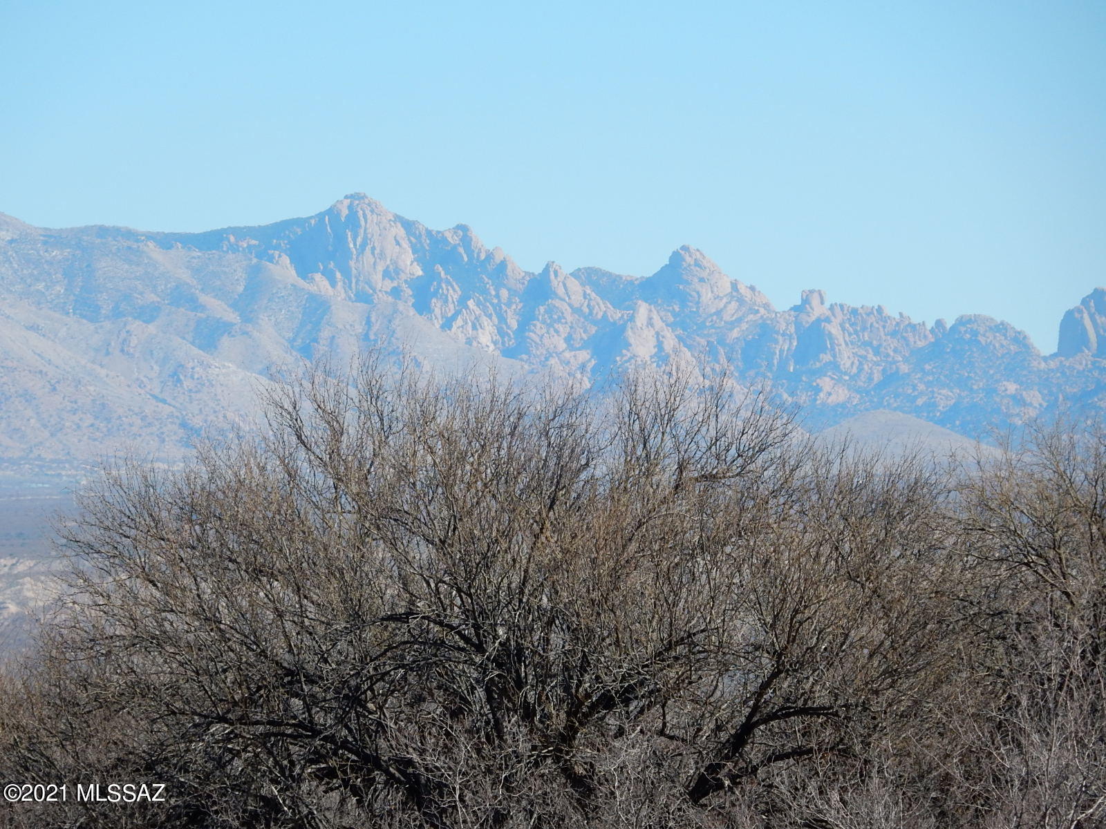40 Acres with capped well and electric at lot line.  Views galore. Recreational Getaway. Horses allowed. Unrestricted Land! No HOA. Zoned RU-4. Can subdivide.  Manufactured homes allowed.  Stunning view of the Dragoon Mtns.  Sunsets and Sunrises.    Lots of room to ride horses or hike.  Good sandy wash coming thru property .   Owner will consider Seller Carry back  on the property.