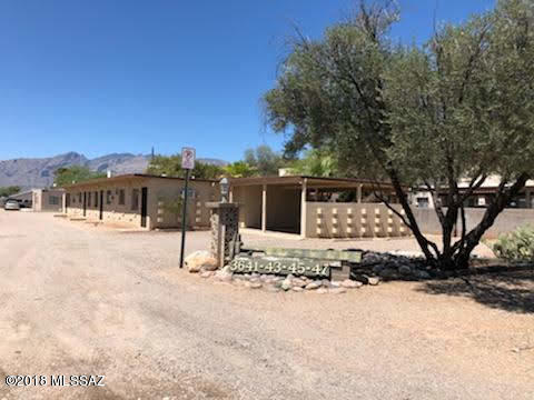 Cozy 1 bedroom home with small private yard, storage and covered parking.