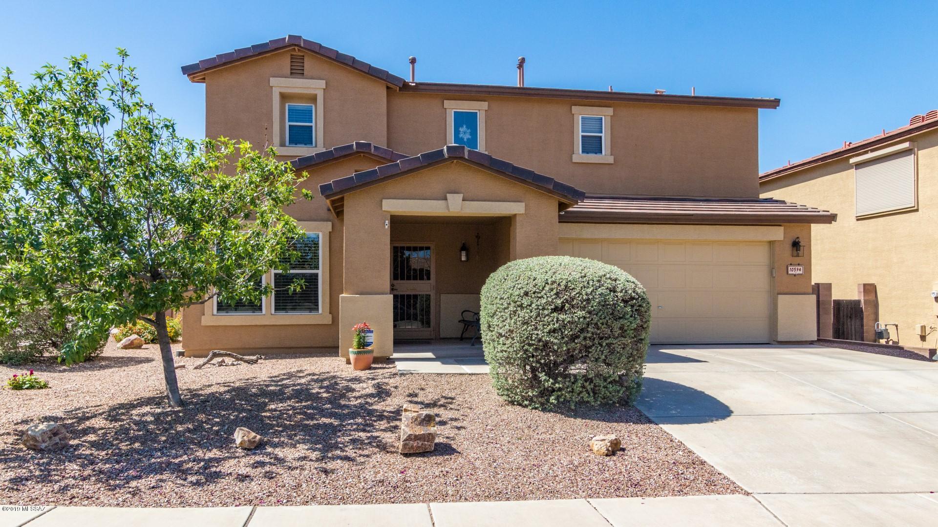 Beautiful two story, 3 bedroom home available in quiet golf course community, Rancho Del Lago. Excellent Vail location, within easy reach of the I-10. Inside is bright and very well maintained. Desirable floorplan offers a formal living and dining area as well as a separate family room with beautiful wood laminate and tile flooring with soft natural lighting throughout. Designed for entertaining, the spacious open kitchen features an abundance of solid hickory wood cabinetry and an island with breakfast bar. Upstairs is a large loft, perfect for an office or media room. Sprawling backyard is complete with a covered patio, 10X12 workshop with electric, and a putting green. An ideal spot to enjoy Arizona outdoors. This gem is sure to impress. See it and make it yours.