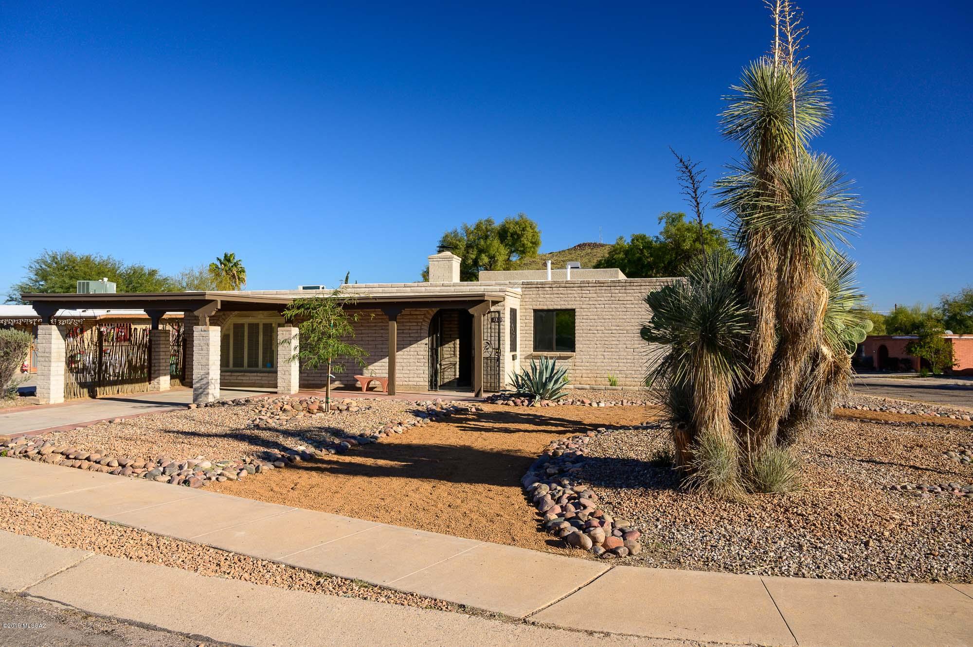 FABULOUS MOVE-IN READY TOTALLY REMODELED HOME on Tucson's west side. 3 bedroom, 2 bath home with bonus play room/office, raised ceilings with exposed wood beams, two fireplaces, and new tile throughout. Home has 2,351 square feet of luxury, privacy, and good taste. Two HVAC split systems.  New: tile, lighting, baths, fixtures, kitchen, granite counters, interior walls, cabinets, sinks, showers, faucets, walking closet and more. Great location with a short drive to Pima Community College West, Starr Pass, downtown Tucson, & I-10. It won't last long so come and see everything this home has to offer today!
