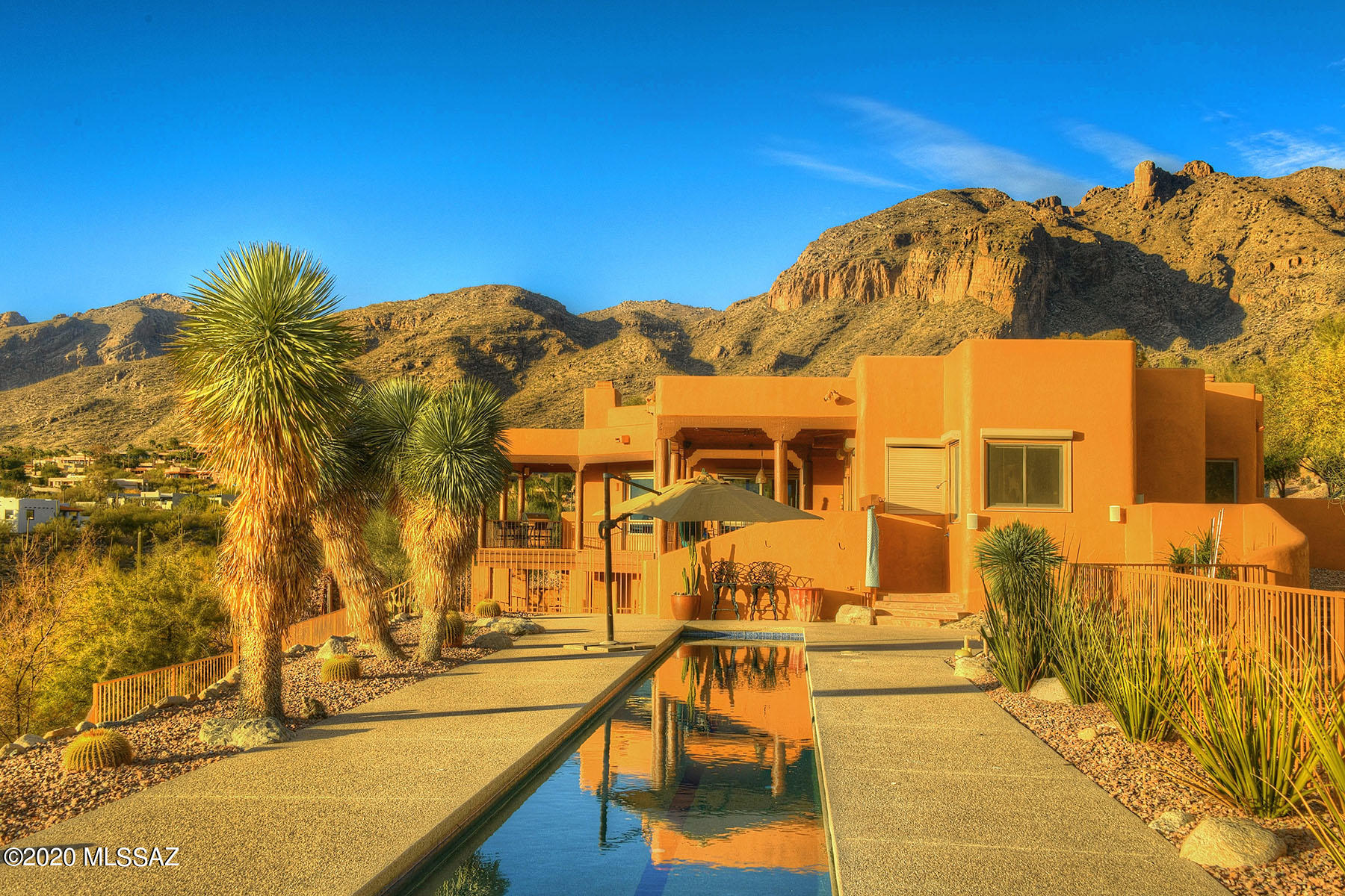 Stunning home nestled in heart of Catalina Foothills w/ panoramic mountain views & dazzling city lights. Move in ready! Everything has been done. Magnificent floor to ceiling windows w/ 180 degree views in great room will take your breath away. Private & gated neighborhood. Entertain in beautifully designed Great Room w/ hand dry stacked stone fireplace & easy flow to dining & kitchen. Main floor hosts owner suite & office/guest bedroom w/ full bath. 100% remodeled kitchen by Southwest Kitchens w/ Butler pantry, new SS appliances, built-in separate ice maker & prep sink are a few of the dreamy details. Retreat to upgraded owners suite w/ Rolling shutters, custom blinds, steam shower, heated floor, custom closet & soaking tub. Split Plan, XL 3 Car Garage, Workshop, Lap Pool! See More tab... much more, like a Toto Neorest 600 Toilet with Bidet, mini dryer in the bath for your wet towels. You will find 2 guest bedrooms, extended 3 car garage & dream workshop on the lower level. Experience the beautiful Tucson landscape year round w solar heated lap pool w/ outdoor shower & infrared patio heater. Breathtaking patios & extensive landscape lighting highlight this desert gem. 

3505 E Windy Point 
Features and Upgrades

Completely Remodeled Kitchen: new cabinets, counters, all new appliances, built in separate ice maker, LED lights, recirculating hot water to sink, prep sink. Done by 'Southwest kitchens' new flooring & added Butler/walk in pantry.
Remodeled Great Room: feature wall with built in gas fireplace, flat screen TV, hand dry stacked stone, all flooring & more
Completely Remodeled Owner Suite, Closet & Bath: Cabinets, Steam shower, added in bath dryer, Toe-Kick heater, custom closet system, Toto Neorest 600 Toilet with Bidet, crown molding, rolling shutters, electric window treatments & all new flooring.
Custom built-in office desk
New interior window treatments
Shade Screens
Gated & natural stone front courtyard
New Landscaping & rockwork through out
Replaced hot water heaters
3 new HVAC units American Standard
New Water Tec water softener
Control 4 Smart Home wiring system
Drive & walkway expanded and added pavers
Rebuilt rock retaining walls for entire property including new rock drainage Extensive landscape lighting
2 New garage door openers
Added solar heat for pool
Added Infrared patio heater
Exterior of house painted in December 2020
Roof completely redone 2014. Yearly coating maintained
Recessed gas firepit on pool deck
Piped natural gas line for BBQ
Alarm & Ring system (front & back)
Added outdoor storage room
Custom mesquite hanging shelves
Panoramic views from every window
Huge 3 car garage  expanded space, height & length
Spacious dream large dedicated Workshop in garage with 220 service 
Cul-de-sac lot sits on over an acre
Outdoor shower
Beautiful long Lap Pool with new electric cover
Laundry chute 
Storage Galore
Concrete flooring
Upgraded baths
Large laundry room with sink & storage
Walk in closets in 2 of 3 additional bedrooms
Private walkway & patio leading to pool for 2 downstairs bedrooms Spectacular views from peaceful meditation area featuring custom statue 
Everything has been done and it's been done right!
WELCOME HOME!
