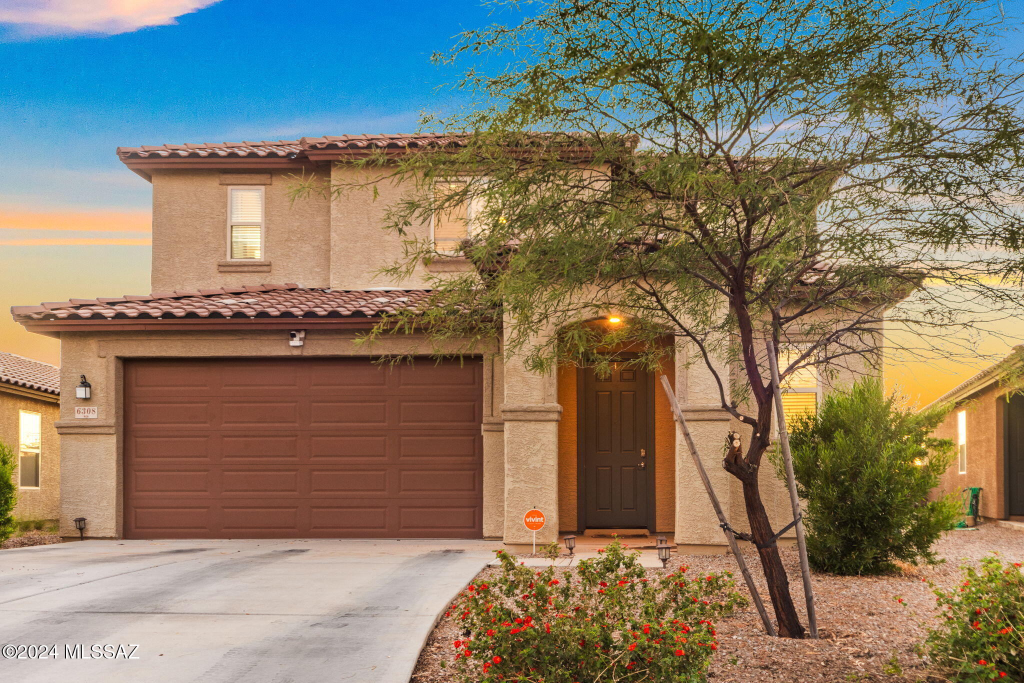 Seller will counter or accept offers between $365-385k. Welcome to this stunning 4-bedroom, 2.5-bathroom home in a peaceful community on Tucson's southwest side. Built in 2020 and lightly lived in, this property sits on a premium lot with an extra buffer of space, creating the feel of no rear neighbors and added privacy. Enjoy quick access to shopping, entertainment, and major highways, making your commute a breeze. Inside, updated flooring, extra-high ceilings, and beautiful stone countertops enhance the bright, open layout. The upstairs loft provides a flexible area ideal for an office or lounge, and the fully landscaped backyard offers room to relax and grow. With low HOA fees and modern amenities throughout, this home perfectly combines style, comfort, and convenience. Come see today!