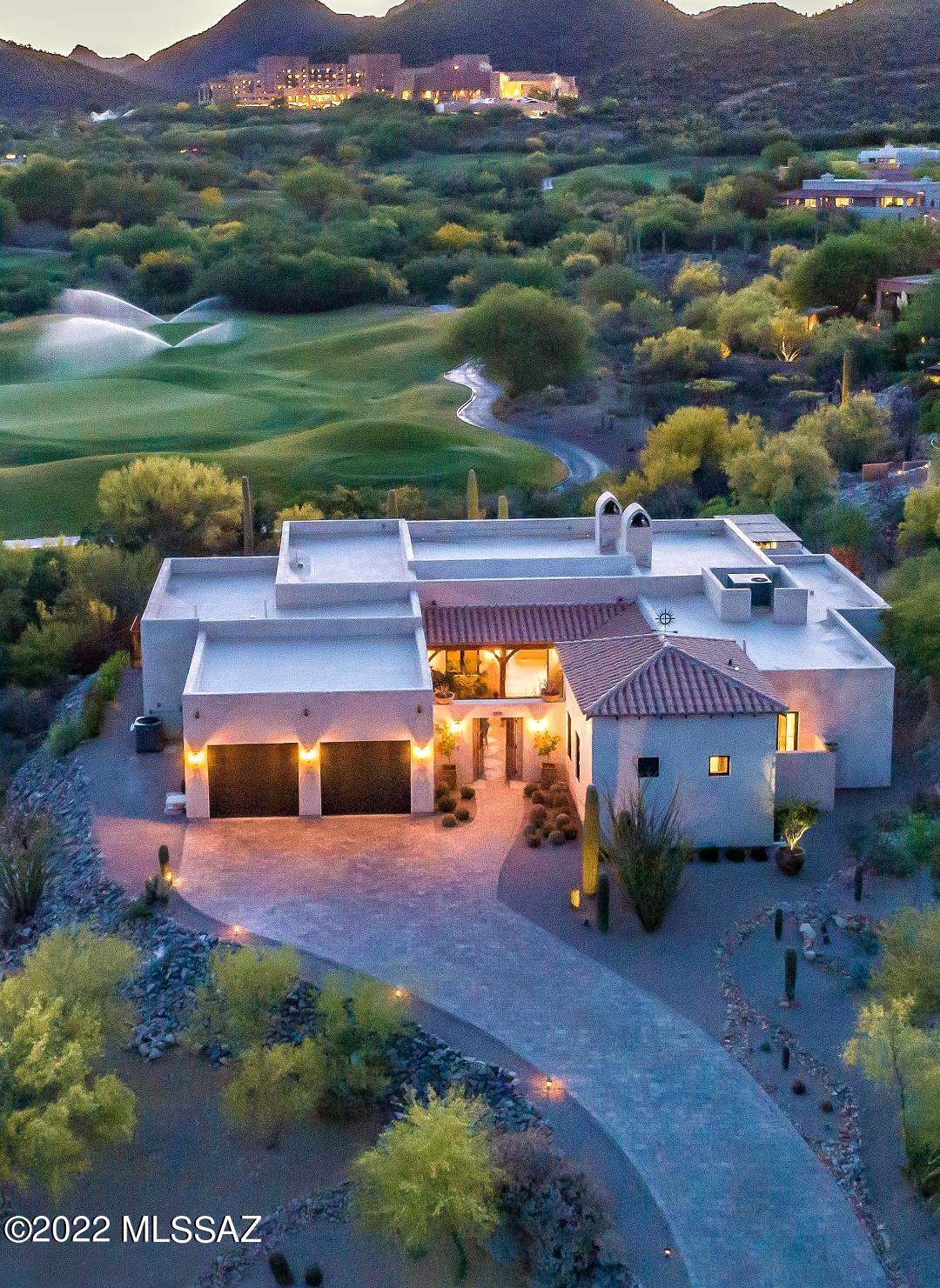 True resort living in this stunning contemporary home w/ distinct Tuscan finishes on the 8th green of the 27 hole JW Marriott Starr Pass Golf Course designed by Arnold Palmer. Elegant & tasteful attention shows in every detail of this NYC designer's own custom home seen in Veranda & Milieu magazines. Enter through a gated hacienda style courtyard with imported antique Timbers & 30x30 checkered stone tile into a great room w/ 10' high stackable doors that open to bring the outdoors in.  Four ensuite bedrooms have marble counters & access to wonderful outdoor spaces.  Kitchen has white oak custom cabinets, marble & soapstone counters, 315 bottle built in wine cooler & Italian range w/gas cooktop. Hand crafted concrete tile flooring throughout main living areas. Enjoy sunsets from the salt water pool or spa with travertine coping. So many amenities to enjoy at the JW Marriott Resort & Spa, including clubhouse w/fine dining, fitness classes, Hashani Spa, guided hiking, biking, rock climbing and so much more. Just minutes from Saguaro studded trails, downtown dining/entertainment, & the Tucson airport.