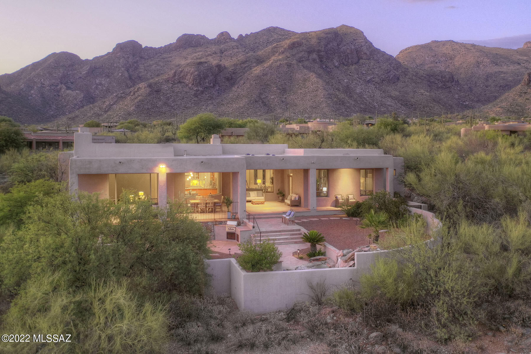 Perfectly situated in the heart of prestigious manned-gated, PIMA CANYON ESTATES & sited w/ private, stunning City & Catalina Foothills Mtn views. This soft-contemporary melds superior 12'' Rasta Block ICF construction & the finest of Tucson living. Exquisite living rm w/ high ceilings, bright walls of modern curved windows/natural light, formal dining rm, gourmet kitchen/gas island cooktop, open/split floor plan, 2 gas fireplaces, full length flagstone covered patio w/ wood ceilings - Indoor/outdoor entertaining, built-in BBQ & water feature, dual master closet, 3 car garage + bonus rm w/ A/C. Office can easily be converted to a 4th bdrm. Great lock & leave. Oversized 1.4 acre lot. Around the corner from upscale La Encantada shopping, Whole Foods/AJ's markets, galleries & walking trails.