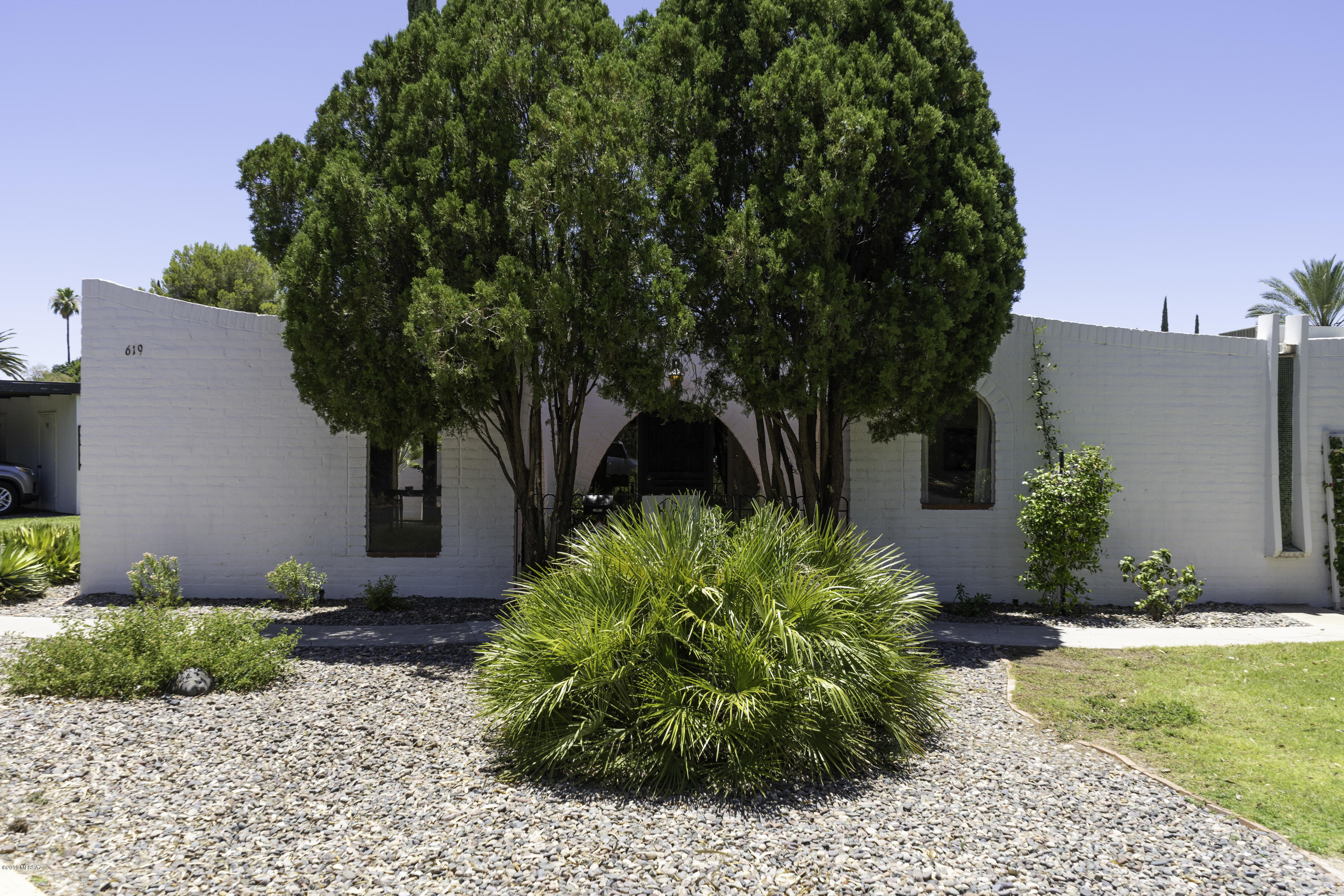 CHARMING 2 BR/ 2BA CONDO IN CASITAS DE CASTILIAN, AN OVER 55 COMMUNITY DESIGNED BY RENOWNED ARCHITECT BENNIE GONZALES SITTING ON 17 LUSH ACRES OF COMMON AREA. AMMENITIES INCLUDE A LIGHT AND BRIGHT FLOORPLAN, NATURAL BURNT ADOBE CONSTRUCTION, LOVELY FRONT AND BACK BRICK PATIOS, ARCHED WINDOWS, SKYLIGHTS AND CEILING FANS PLUS A GREAT POSITION IN COMMUNITY NEAR POOL AND CLUBHOUSE. HOME NEEDS UPDATING BUT HAS BEEN WELL MAINTAINED AND HAS GREAT BONES! HOA FEE COVERS WATER, GARBAGE PICK-UP, MAINTENANCE OF BUILDINGS AND GROUNDS, 2 POOLS, TENNIS AND CLUBHOUSE! TWO PETS ARE ALLOWED PER UNIT (ONLY ONE CAN BE A DOG) AND BUYER MUST LIVE THERE ONE YEAR BEFORE BEING ALLOWED TO RENT.