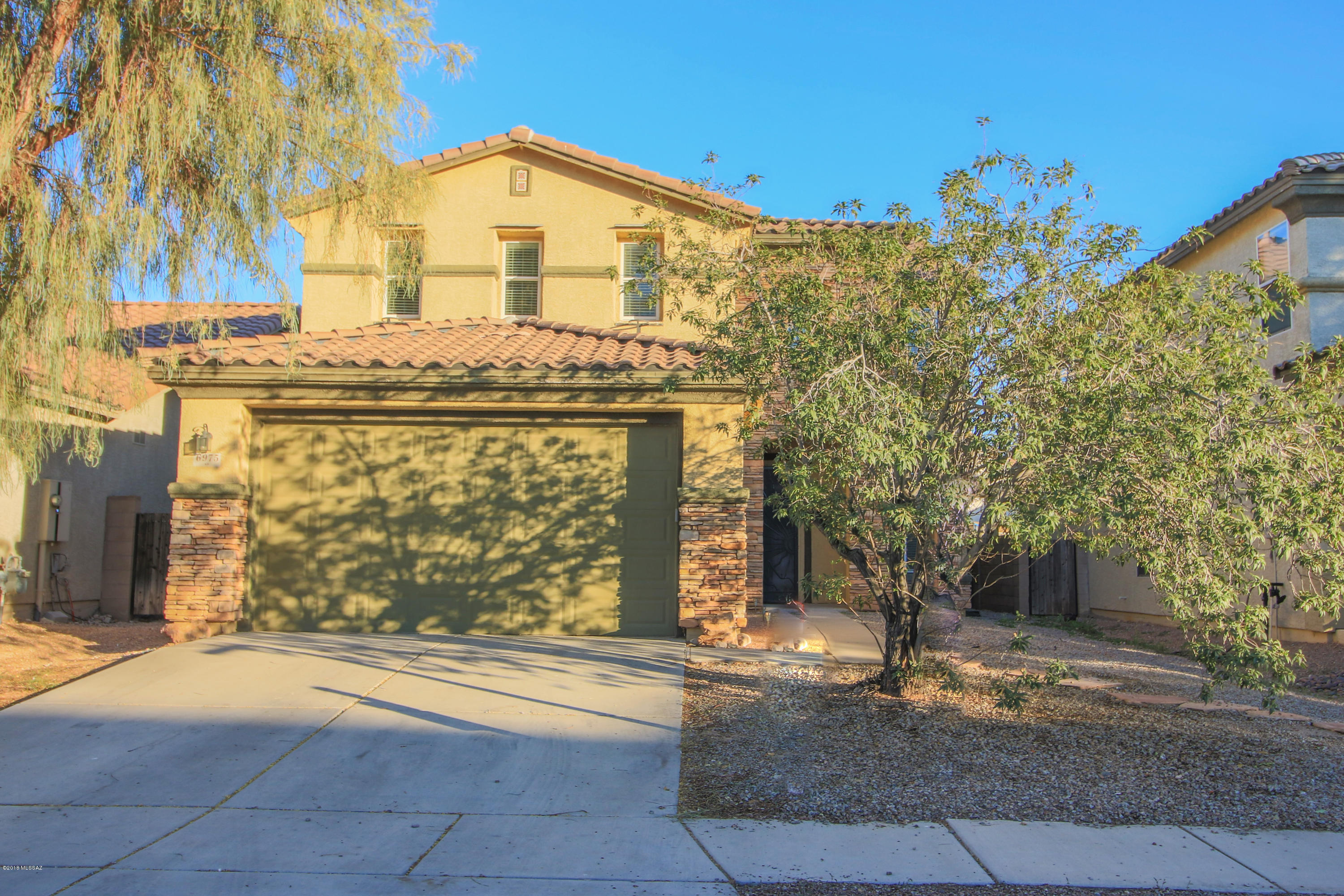 Seller is willing to entertain offers between $225K-235K.
Spacious like new home in Rancho Valencia.  2 tone exterior paint job with stacked stone.  Truly a gem of the neighborhood!  Large open rooms with entertaining space upstairs and downstairs. Formal living/dining area with pass through to kitchen.  Kitchen has tall, custom cabinets with crown molding, and plenty of them.  Eat in dining area with a breakfast bar.  Over-sized loft area with full size bathroom close by.  Covered patio with a low maintenance backyard.  Located close to Davis Monthan Air Force base and Freeway for close access to anywhere in Tucson.