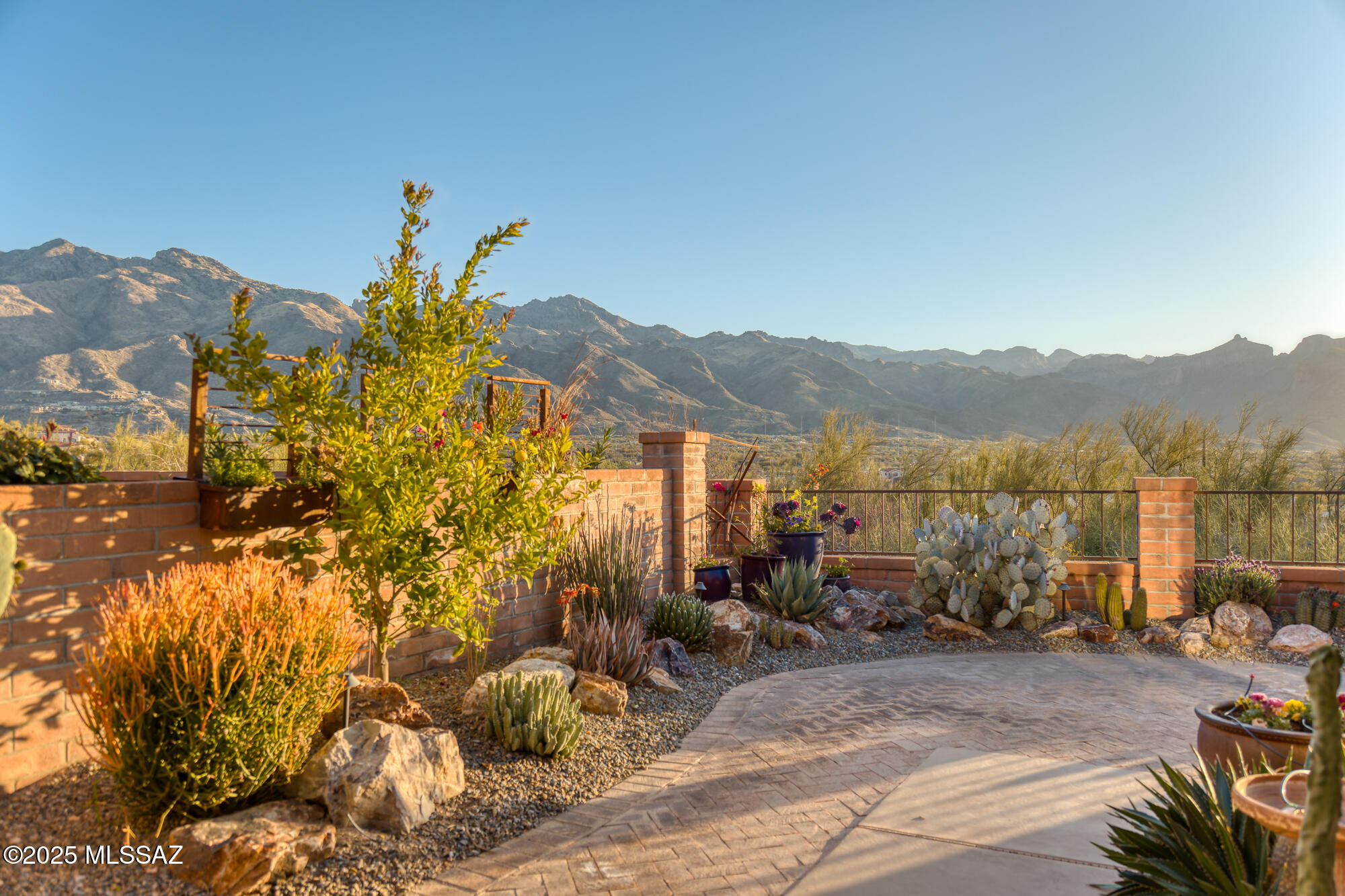 Unobstructed Catalina Mountain Views! Perched on one of the most coveted ridge top lots in Fairfield, this beautifully renovated townhome offers breathtaking panoramic mountain views. This is the ultimate lock & leave desert home. Just minutes from Whole Foods, great restaurants, & shops. Thoughtfully designed landscaping compliments the serene desert setting, creating a peaceful & private retreat. Step through a custom metal gate into a charming courtyard, w/ lush desert plantings & citrus trees . Inside, the remodel has transformed the space—ceilings have been raised for an airy, open feel, a wall was removed to enhance flow, & the home features a brand-new kitchen w/ honed granite counters, custom cabinetry, & stainless steel appliances. New concrete floors throughout by Rogos, new solid core alder wood doors with upgraded hardware, & new interior paint March 2025. Glass all a The owner's suite has beautiful views of the mountains & a renovated bathroom with dual sink vanity & custom tile surround shower with a glass door. Large walk-in closet with built-in shelving. Second Bedroom has a lovely private patio. Bedroom #3 can also be an office or a flexible space to suit your needs. Outside, tile roof verandas wraparound two sides of the home providing many opportunities enjoy the views and privacy offered at this home.   The community includes swimming pool & tennis/pickleball court.