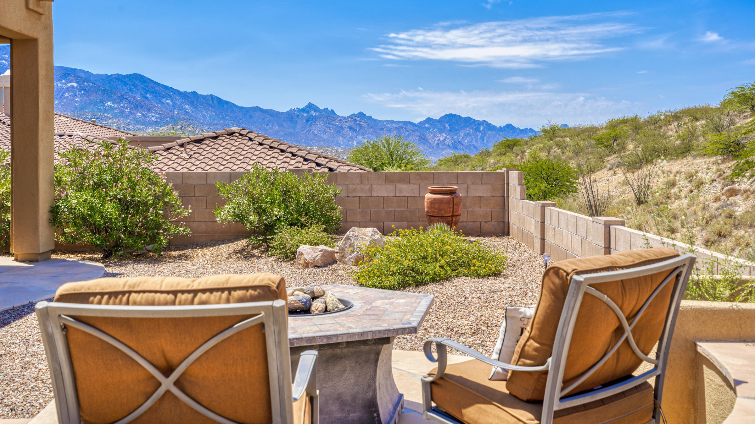Why wait to build? This lightly lived-in Sonoran model in SaddleBrooke's Preserve is waiting for you. Walk through the arched entry into a welcoming private courtyard w mtn views. Plank style porcelain tile floors lead you into a spacious great room anchored by a fireplace & wall of windows. The gourmet kitchen features granite counters, rustic cherry cabinets, stainless appliances including corner gas cooktop. Butler's pantry w wine refrig leads to the dining room. Master suite w en-suite w walk-thru shower, separate vanities, soaking tub & walk-in closet w access to laundry room. Convenient den, powder room, guest suite, private casita plus 3 car garage. Outside enjoy the covered patio or sitting around the firepit & enjoying South mtn views. Over $250K in upgrades. This is a MUST SEE!