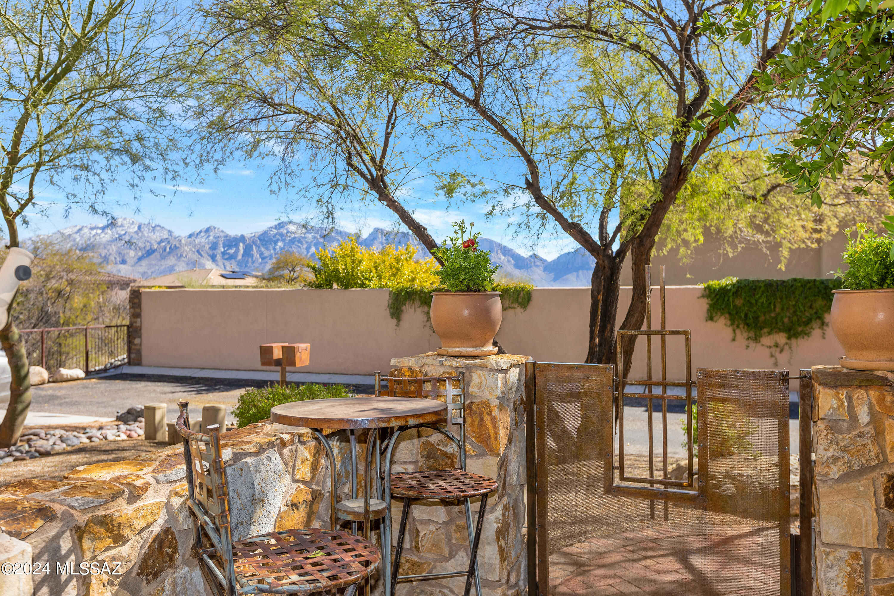Stunning Kevin Howard Design in a very desirable Gated Oro Valley Neighborhood . Backs up to Natural Desert with Tortolita Mountain Views out Back & Catalina Views out Front. Its the perfect north/south orientation! 
3 bedroom ( one being a casita ) and 3.5 bath 2430 sq ft of perfectly designed living space . High ceiling height and loads of windows bring in the natural light & desert beauty. 
The generous size kitchen is perfect for the most discriminating chef , accompanied by a curved wall nook and overlooks the large great room .
The great room overlook both the front courtyard & the covered back patio , its your decision where you want to start your evening of entertaining ? 
This is one of the few communities the renowned architect Kevin Howard designed floor plans for !