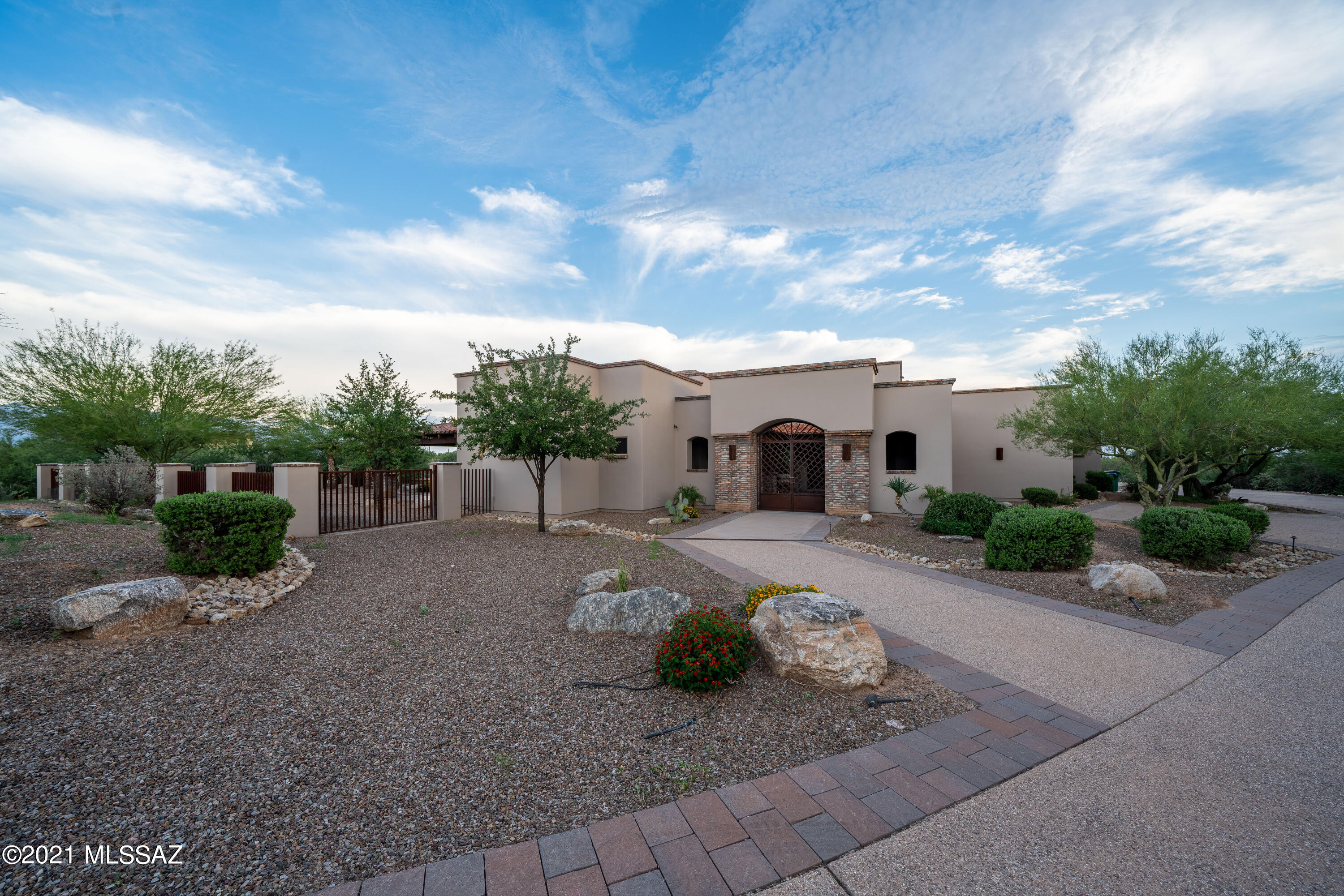 Looking for your very own desert oasis? Beautiful 6 bedroom home located on Tucson's NW side, nestled amongst panoramic views of the Santa Catalina Mountains.This expansive property comes with several amenities including a private guest house. With a spacious covered patio, a custom outdoor kitchen, pool and spa. Enjoy the best things Arizona has to offer from the comfort of your very own backyard. Lavish Master Suite with fireplace, private patio and an exceptional bath experience. Stunning granite counter tops in the kitchen with stainless steel viking appliance, and an open dining area. The great room highlights a gorgeous fireplace, vaulted ceilings, exposed beams, and surround sound. This home is truly one of a kind.