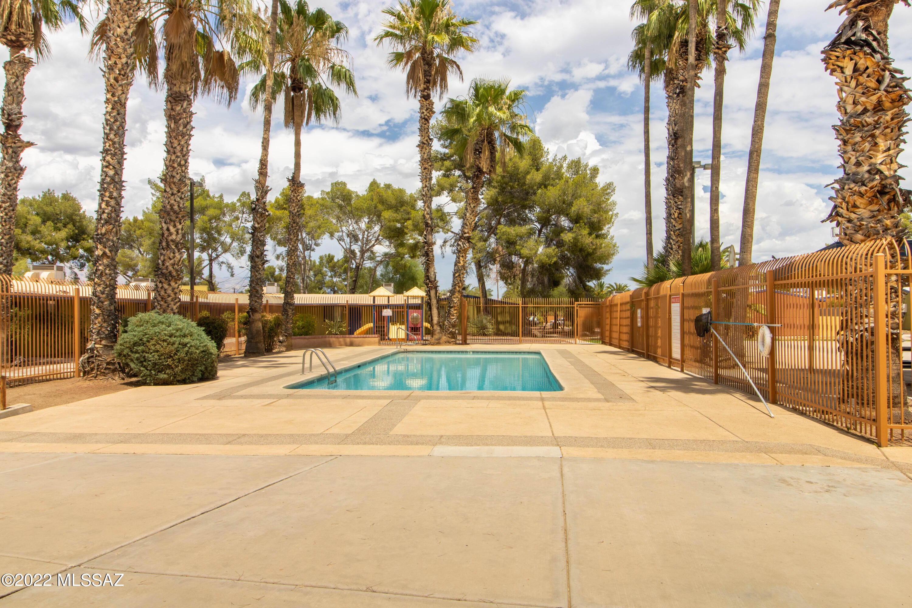 Remodeled condominium just blocks from Saint Mary's Hospital, Tumamoc Hill, Shopping and Entertainment, and easy freeway access. GATED COMMUNITY. No stairs in unit. Large sized fenced back yard with covered patio. Well maintained common areas and COMMUNITY POOL.