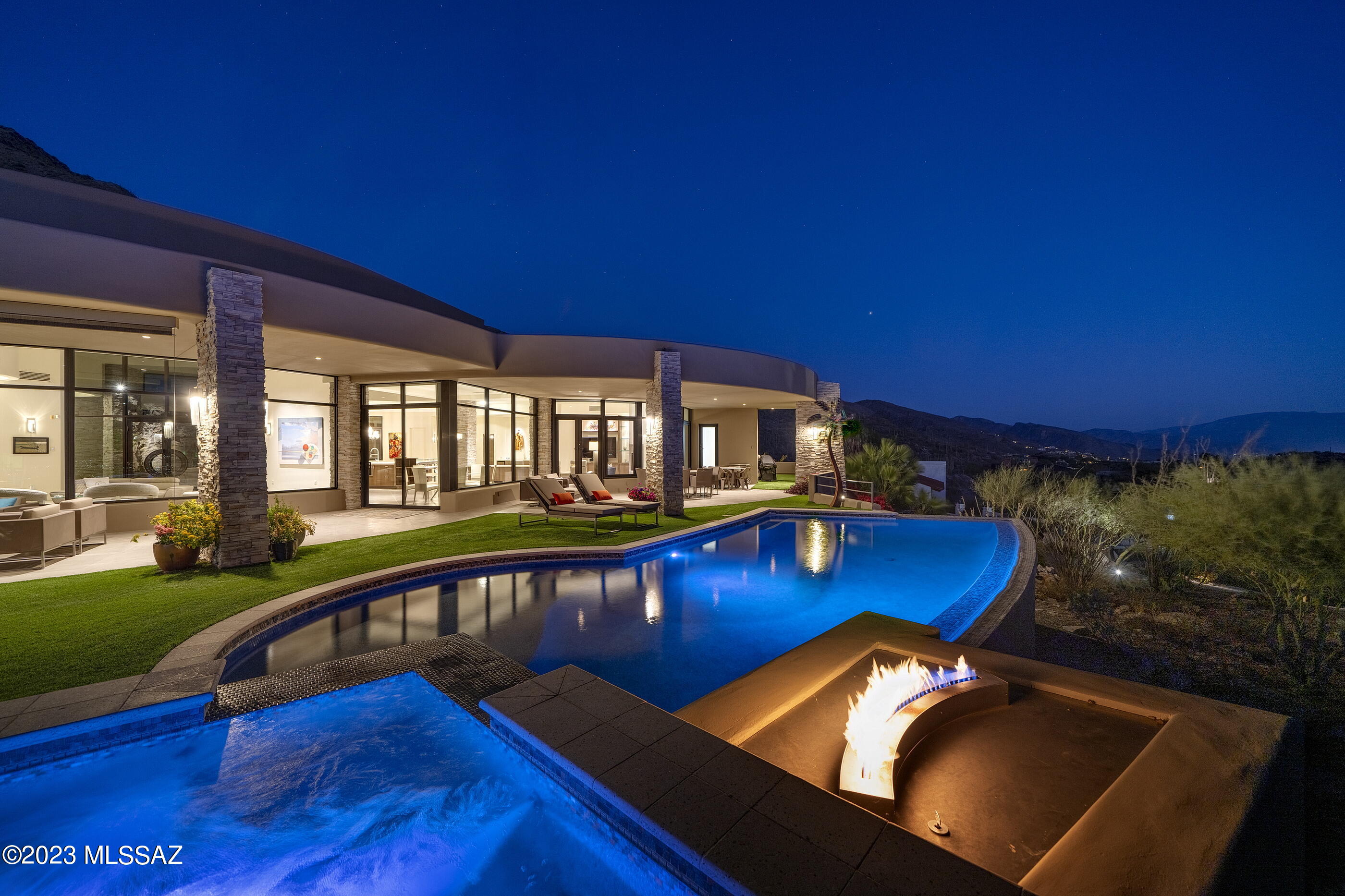 A pure expression of contemporary architecture, located within the prestigious confines of Skyline Country Club, with inspiring city and mountain views that converge in a seamless panorama. Meticulously designed by Kevin Howard and crafted with an architectural vernacular that combines innovation and timeless design, setting a new standard for luxury living. Representing an unwavering commitment to craftsmanship and the tactile quality of materials, where lines and surfaces evoke a sense of perpetual motion, while simultaneously allowing one to become the curator of their own experience. The dialogue between interior and exterior is intentionally orchestrated to blur the distinction between form and nature. Expansive windows frame the surrounding landscapes, infusing each space with the ever-changing cadence of light and shadow. 

The kitchen, acting as a center point of the home, is not solely a culinary workspace, but invites its users to engage in the rituals of daily life, where activities become a sensory experience. Tones and textures, juxtaposed against natural stone and high gloss millwork create an intrinsic beauty found in the authenticity of the materials. At the heart of this epicurean experience is a suite of professional series appliances that merge functionality with a design-forward sensibility, elevating the art of the culinary experience.

The design ethos extends to the primary suite, where form and functionality coalesce. Every detail is carefully considered, from proportions, to the choice of materials, with bespoke cabinetry that seamlessly integrates within the space, while maintaining an uncluttered aesthetic that resonates within the broader design narrative.

Perfectly sited along the Southern edge of the residence, the outdoor spaces, sculpted from the natural topography, create an immersive living environment that echoes the contours of the structure. An elongated covered veranda overlooks the pool and spa, which become more than just amenities, but rather create a symbiotic relationship between the architecture and liquid landscapes, which include an elevated spa, acting as an intimate counterpart to the expansive pool. If you are looking for a home that challenges preconceptions, invites exploration, and leaves an indelible mark on the fabric from which this homesite was selected...look no further!