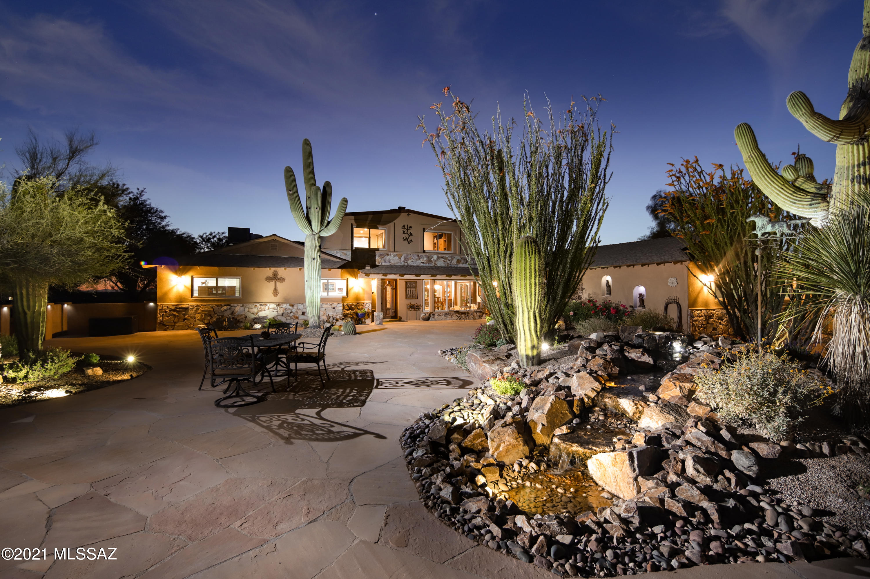 LUXURY RANCH RETREAT... Uninterrupted 360° views on this gorgeous 5 acre horse property. Luxury upgrades and artisan finishes throughout this 4 bedroom, 2 bathroom residence with loft. Dynamic lighting compliment both front and rear courtyards, perfect for entertaining guests or simply relaxing in your own private getaway. In winter, curl up by the fire. In summer, cool off in the sparkling salt water pool. Enjoy a ride along Pantano Wash or work on your projects in the 864sq/ft workshop/studio. The property is fully fenced, has 3-6 horse stalls depending on configuration, spacious tack room, round pen and arena. Loads of functional and quality extras, this one has it all!
Featured in the June edition of Tucson Lifestyle Magazine

Photos: Ron McCoy Ranch or Resort-style living . . . 5-acre fenced horse property offering stunning 360° views of all four mountain ranges and spectacular sunsets. Bring your horses and outdoor toys and get ready to enjoy quiet evenings . . . or host elegant parties at this entertainer's paradise, either within the walled front courtyard with its soothing waterfalls, or your backyard with its inviting pool.

This 2 story, 4 bedroom, 2 bath, 2,800+ sq ft home features complete privacy with the feel of the outside opening up to the inside from every vantage point. Porcelain tiled floors are featured throughout this beautifully appointed layout utilizing high-end materials and artisan touches.

Property boasts a spacious Tack Room, stables, hay storage, round pen, turnout, arena and direct access to the Pantano Wash for endless miles of trail riding without ever having to hitch up a trailer. Complemented by a large, fully-equipped & stocked, 36' x 24' workshop, which can easily be converted into a crafts and art studio, or second garage.

Amenities and Features

Interior - Kitchen
Thermostatically controlled heated floors
Built-in automatic in-wall coffee/tea maker hard-wired with integral plumbed-in system providing filtered water
Granite Countertops and custom cabinetry
High-End GE Profile Stainless Steel Appliances including an Advantium Convection/Microwave Oven
Chef's island with Induction Cooktop
Corner Appliance Garage with built-in electric outlets

Interior - Laundry
Laundry Room behind hidden door provides for convenient accessibility coupled with aesthetics and noise reduction
Spacious room with generous amounts of custom cabinetry storage space, granite countertop with sink and HE appliances

Interior - Great Room
Wet Bar with built-in dual-temperature control wine fridge
Fireplace
Built-In 47" 3D TV
Custom Cabinetry

Interior - 2nd Story Master Suite
Thermostatically controlled heated floors in Master Bathroom
Shower handle is strategically located to allow one to warm up the shower without getting your arm wet
Jetted Air Tub
Bidet and heated toilet seat
Spacious walk-in closet
Separate sitting room with corner Heatilator Fireplace
Panoramic Mountain Views of the Rincons, Catalinas & Santa Ritas
Custom solid Knotty Alder Doors

Interior - General
Total of seven motorized shades to block radiant heat and maintain energy-efficiency cooling during summer
Electronically-controlled multi-speed ceiling fan in each room
Security camera system monitors entrances with 1Tb HD recording/playback capability
Fenestration consists of high energy-efficient tri-pane windows and sliders with transferable manufacturer's warranty
Automatic Interior undercabinet LED lighting
Solid 7ft Knotty Alder Doors throughout
Porcelain Tile throughout
Dual Heat Pumps with zone control

Interior - Garage
42' x 22' (900 sq ft) with massive amounts of storage cabinetry with over 34' of base cabinets, 42' of 30" wall cabinets and five 7' x 18" tall cabinets
Incorporates a walk-through mud-room section complete with wash-up facilities
Custom Tiled-Countertops
Convenient Wall-Mounted ShopVac
Showroom-Class Decorative, Low-Maintenance Epoxy Sealed Floor

Exterior - Equestrian Center
Heated 24'x12' Tack Room featuring wash basin with hot water, operable skylight, fridge, ceiling fans, laundry machine, phone lines and convenient wall-mounted shopvac
60' Round Pen, with floodlights for nighttime activities as well
4-stall barn with covered runs (three measure 36' x 12' and one is 24' x 12'), automatic waterers
Hot water supply available outside of Tack Room for washing and grooming
Center breezeway with ceiling fans and lighting
Hay storage area with lighting and convenient entry on two sides
Turnout with shade structure with timer-controlled ceiling fan (located next to round pen)
Large area near house for use as an arena
Ride directly off the property to enjoy miles of trails without the need to trailer the horses

Exterior - Detached Workshop / 2nd Garage
36' x 24' (864 sq ft) equipped with plumbing, electric, operable skylights and cabinets galore
Mechanic's retractable troubleshooting lamp - convenient pull-down from ceiling
Dual industrial-grade ceiling fans with speed adjustable controls
Wash basin with hot water tank

Exterior - Front Courtyard
Elegantly appointed and designedperfect for small weddings, receptions, catered events of all kinds
Waterfalls (with variable speed control)
Niches (for artwork and/or statuettes)
Decorative wrought iron gates
Hand-carved, solid Mahogany double doors create a majestic entrance
Stylish, multi-level design with flagstone, decorative stones & rocks with stunning array of desert plants & cacti featuring: three gigantic Saguaros and Ocotillos
Free-standing Pergola
LED illuminated stucco walls for spectacular night lighting
Automated irrigation system
Conveniently located hose bibs (four)

Exterior - Back Courtyard
Saltwater Pool with LED Lighting
Hot and cold outdoor poolside shower
Stylishly designed with decorative wrought iron gates
Raised Terrace for seating or entertainment providing majestic views of all four mountain ranges
Low maintenance but attractive array featuring decorative crushed stone and Flagstone
LED illuminated stucco walls for spectacular night lighting
Automated irrigation system
Conveniently located hose bibs (four)

Exterior - Other
LED landscaping night-lighting is controlled by intelligent systems devised from unique combinations of timers and photocells¹
Two Private Driveway Entrances with motorized gates
Driveway System attractively engineered within the property provides convenience for owners, guests, receiving deliveries, etc. and also allows for a variety of recreational activities (horseback / quad/ATV riding / biking / walking/hiking)
Huge Chicken Coop, large enough to be suitable for dogs
Enclosed irrigated vegetable garden



Amenities

    Central Air
    Central Heat
    Bedroom on Main
    Controlled Access
    Courtyard
    Covered Patio
    Deck
    Dining Room
    Dishwasher
    Electric Oven/Range
    Entrance Foyer
    Family Room
    Fenced Yard
    Fireplace
    Furnished
    Garden Area
    Granite Countertops
    Great Room
    Island
    Laundry Closet
    Laundry Room
    Living Room
    Microwave
    Pantry
    Patio
    Porch
    Private Backyard
    Refrigerator
    Security System
    Septic Tank
    Skylights
    Sprinkler System
    Stainless Steel Appliances
    Swimming Pool
    Tile
    Walk in Closet
    Washer/Dryer
    Workshop