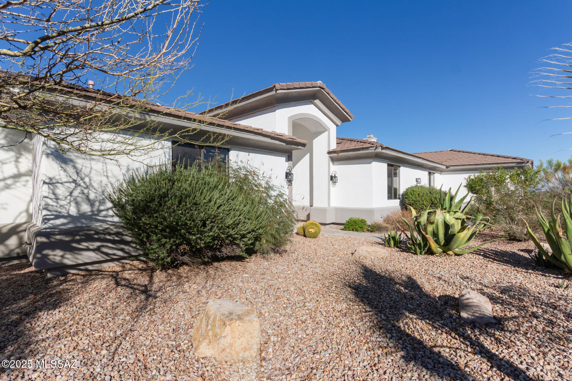 Nestled in the tranquil foothills of Tucson's west side, this newly remodeled home blends modern elegance with the breathtaking natural beauty of the desert. Surrounded by sweeping mountain vistas and sparkling city-light views, this residence offers a rare combination of privacy, scenery, and sophistication.

Step inside to an updated interior featuring fresh finishes, thoughtful upgrades, and a bright, open floor plan designed to maximize comfort and style. Large windows frame stunning views from nearly every room, bringing the outdoors in and creating an inviting, serene atmosphere.

The backyard is an entertainer's dream. Enjoy Arizona's perfect weather with a sparkling pool, spacious patio areas, and a built-in barbecue grill—ideal for gatherings.