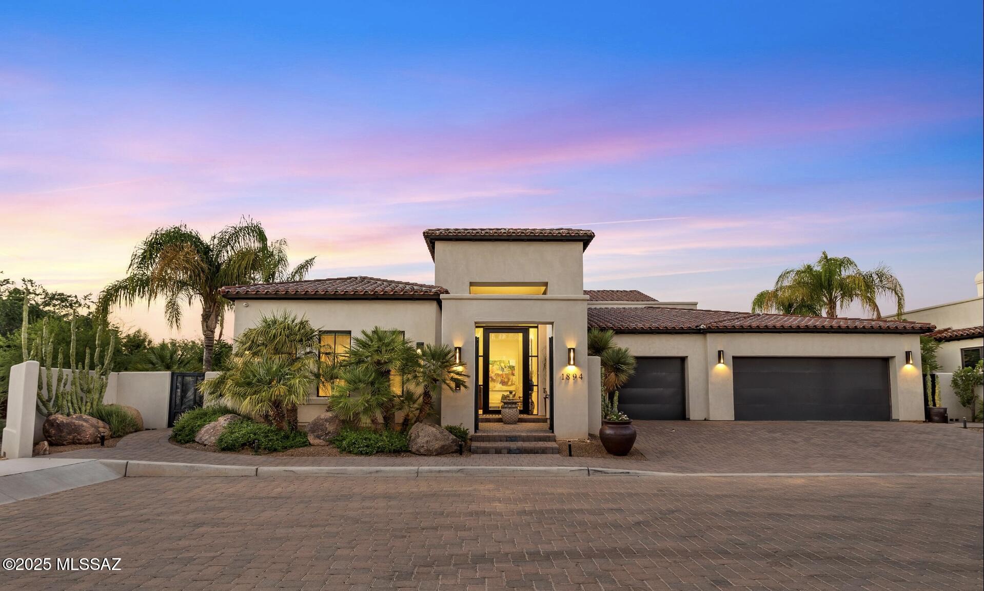 A unique and highly customized Santa Barbara style home is an entertainers dream. The home provides an open layout, wonderful separation of space and  accoutrements found only in the most well appointed homes. Close to the U of A, the historic Arizona Inn and the University Medical Center not to mention all the shopping and restaurants one might need. Entry is through a private, gated courtyard that provides both privacy and security. The entry to the home is a large gallery style foyer that leads to the large great room which is home to gathering and dining areas as well as the gourmet kitchen. The butlers pantry with fffreezer, cooling and warming drawers; ice maker; 2nd dishwasher; and convection oven provides the perfect space to prepare for guests without worry. The private spaces provide luxury and elegance to maximize relaxation. The primary suite offers 2 walk in closets with builtins, a private luxury bath with soaking tub. twin vanities and a make-up center. The 2nd bedroom is bathed with natural light, has a walk-in closet and an ensuite bath. The 3rd bedroom/Den has a closet area and private half bath. Whether you choose to make it a bedroom, a den or a game/media room, this space is flexible and ready to be what you need.

The back patio space is secluded, has mountain views and has heaters, a TV and an outdoor kitchen ready for you. There are also remote controlled shades to completely enclose the area so it is truly useable all year. Listing agent related to seller