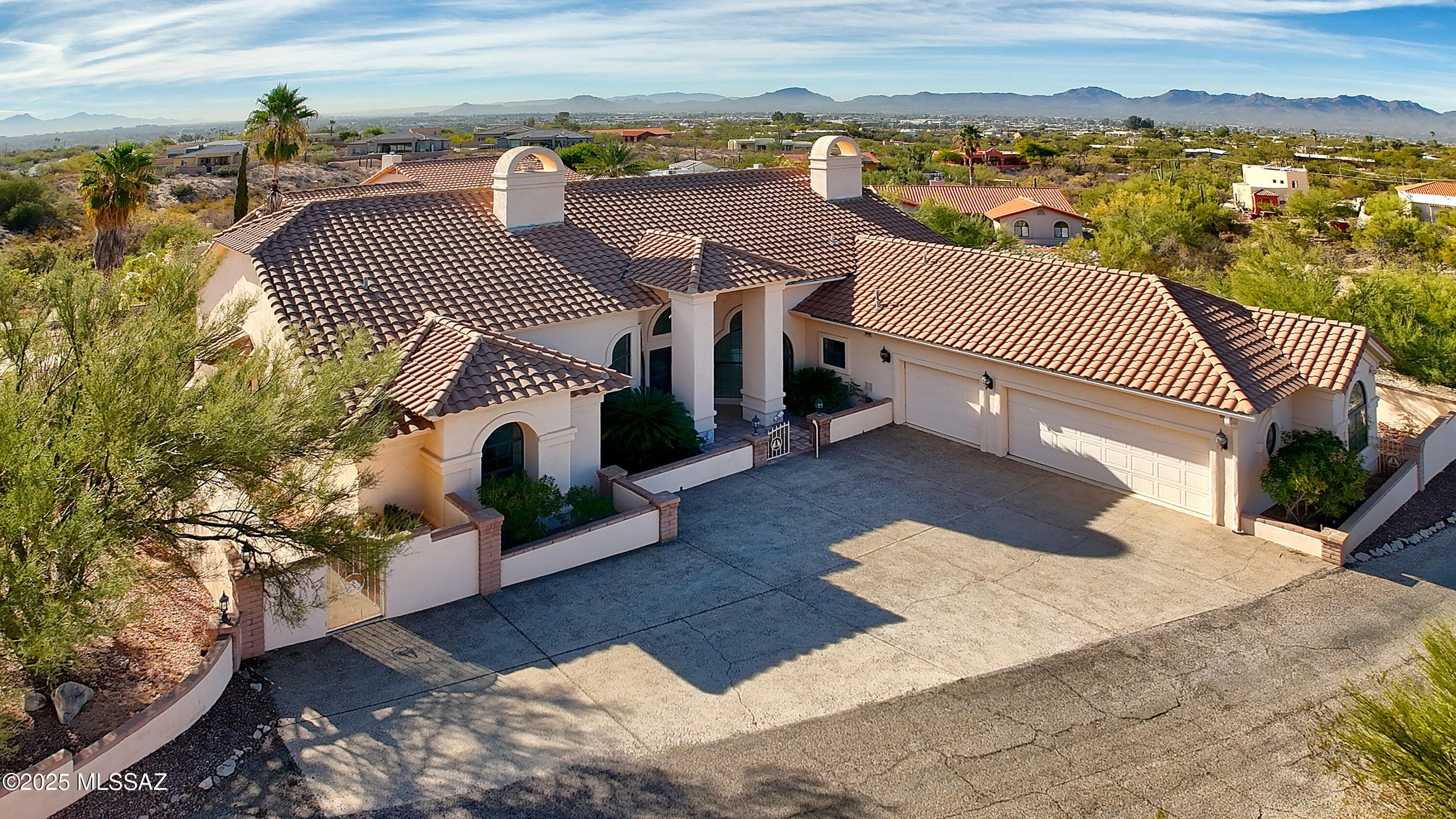 Situated in the picturesque foothills and conveniently located, this timeless home exudes elegance and opportunity. Step through the beautiful double door entry & be drawn in by the unique architectural details, vaulted ceilings & travertine floors. Split plan ensures privacy & the open-concept kitchen w/granite counters, gas cooktop & abundant cabinets flows seamlessly into the spacious greatroom w/dramatic fireplace. Arched windows bathe the home in natural light & the formal dining room w/graceful columns & cozy breakfast nook provide elegant dining options. Generous primary retreat offers jetted tub, dual sinks, walk-in closet & its own fireplace. Lg covered patio is perfect for enjoying spectacular sunsets. Lg laundry room w/sink & storage.  Prime location close to shopping & dining.