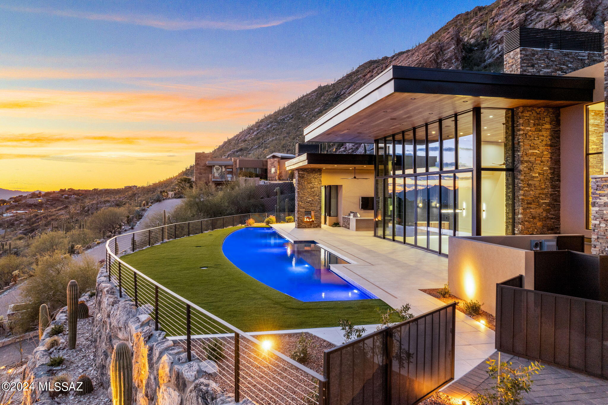 Perched atop the majestic and breathtaking Catalina Mountains, this one-of-a-kind modern masterpiece indulges all the senses and conveys the stunning desert southwest lifestyle on a highly desired 4.31-acre hilltop lot at the very top of Swan Road, in the coveted Summit gated community.  Luxurious attention to detail in every living space of this 5 bedroom, 7 bath, 6,788 SF oasis in the desert. Stunning floor to ceiling sliding windows provide electrifying panoramic city views, while the magnificent Catalina Mountains integrate seamlessly into the warm and functional outdoor entertaining space. High end finishes with eye-catching detail run throughout the home, while lush desert and regal saguaros embrace and surround the entire estate that boundaries with the Coronado National Forest. Elegant, modern, and masterfully designed by master builder Monty Bartholomew, with collaboration from Architect Bill Gansline, this home will set the standard for high end luxury living in Southern Arizona. Early purchase allows buyers the opportunity to work with builder on selecting finishes and cosmetic touches, which will enhance and define the overall feel and experience of owning this amazing, and one-of-a-kind home. Estimated completion December 2023.