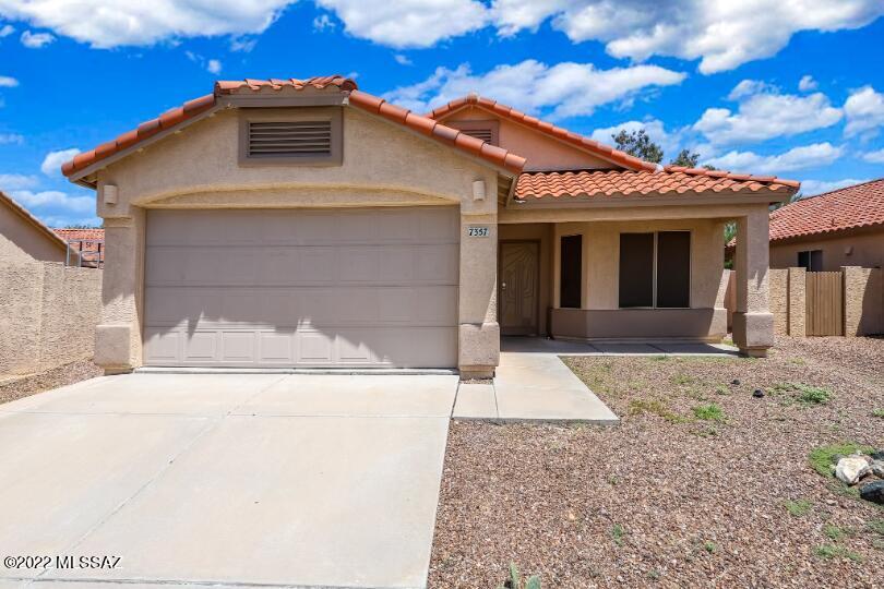 This Reszi home sparkles with tile in the entry, kitchen, dining, hall, laundry, baths. With bright, open, and airy soaring ceilings. The Oak kitchen overlooks the great room. Split bedroom plan, large master retreat, with closet, double marble vanities. Airconditioned, double pane windows, 4 ceiling fans, plant ledges, art niches, security doors, alarm system, refrigerator, washer & dryer, microwave. With a 4ft extension on the finished garage with an opener, workbench, and shelving. laundry with cabinets, covered patio with extended pavers. Archways add warmth. Lots of upgrades and extras! Three words to describe this home. Private. Peaceful. Perfect.