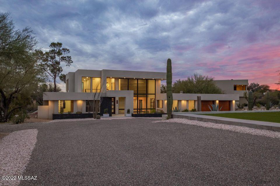 A luxury contemporary designed by architect Kevin B. Howard. A unique property with two homes on one lot in the Catalina Foothills, enjoying both panoramic mountain and city views.This home boasts a custom Italian designed Poliform kitchen, a sparkling white 12 ft quartz countertop island, steam oven, warming drawer, induction cooktop, and extra-large fridge/freezer. Enjoy a spacious walk-in pantry. A custom Media room off the living area with a 80 ft TV screen , custom lighting and a marble fireplace. A dream private master suite occupying the entire second floor with an office, bedroom, walk-in wet room with stone resin tub and double shower-head showers . A walk-in closet with a skylight and walk-out decks overlooking the entire city. The main floor with 3 bedrooms and 3 baths, with an A luxury contemporary designed by architect Kevin B. Howard. A unique property with two homes on one lot in the Catalina Foothills, enjoying both panoramic mountain and city views.This home boasts a custom Italian designed Poliform kitchen, a sparkling white 12 ft quartz countertop island, steam oven, warming drawer, induction cooktop, and extra-large fridge/freezer. Enjoy a spacious walk-in pantry. A custom Media room off the living area with a 80 ft TV screen , custom lighting and a marble fireplace. A dream private master suite occupying the entire second floor with an office, bedroom, walk-in wet room with stone resin tub and double shower-head showers . A walk-in closet with a skylight and walk-out decks overlooking the entire city. The main floor with 3 bedrooms and 3 baths, with an additional rock-climbing/game room. The main home has been completely renovated with all new plumbing, electrical, walls, lighting, flooring, appliances, bathrooms, windows and doors, insulation, garage doors, driveway, and landscaping. For insulation this home is wrapped in waterproofing material, then layered with foam, topped with fireproof concrete boards, and sprayed with a unique and rare cork material from Spain.

The loft/guest house sits separate on property with top of the line finishes. It features 2 bedrooms, 2 bathrooms, an upstairs loft with panoramic city and mountain views. Step outside to a private courtyard to the sound of a fountain flowing. This over 1 acre property provides outdoor space galore with a trampoline, basketball court, pool, grass space in the front and back yards, and a water harvesting system, A homebuyers modern dream home!