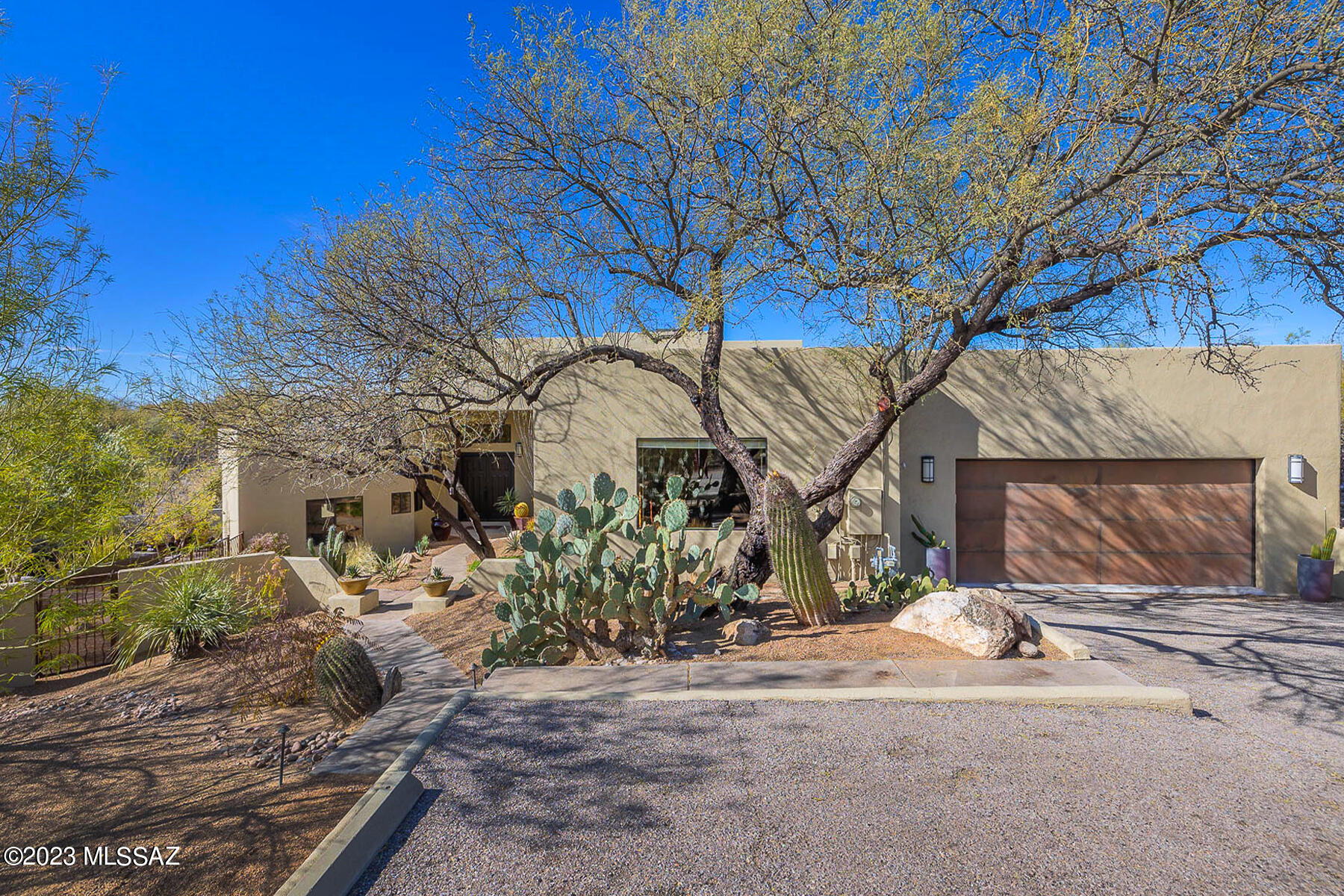 Privacy and views!!! Enjoy your morning coffee in the Prideaux-designed yard with the beautiful Catalina Mountains and Thimble Rock as your background or barbecue on an elevated deck with views of Ventana Canyon.  This 4-bedroom plus office custom home on a cul-de-sac in the Foothills has it all, including an updated kitchen, tile and laminate flooring throughout, wifi-controlled Pebble Tec pool and spa (with in-floor filtration), tons of storage (especially in the oversized garage), tankless water heater, EV outlet, and more.  Don't miss this great opportunity!!!

Note: Some plant pots etc stay--part of the landscape design.  (copy in property) Floorplan is saved under documents.  Rough in plumb under outdoor table by pool for possible outdoor kitchen later.