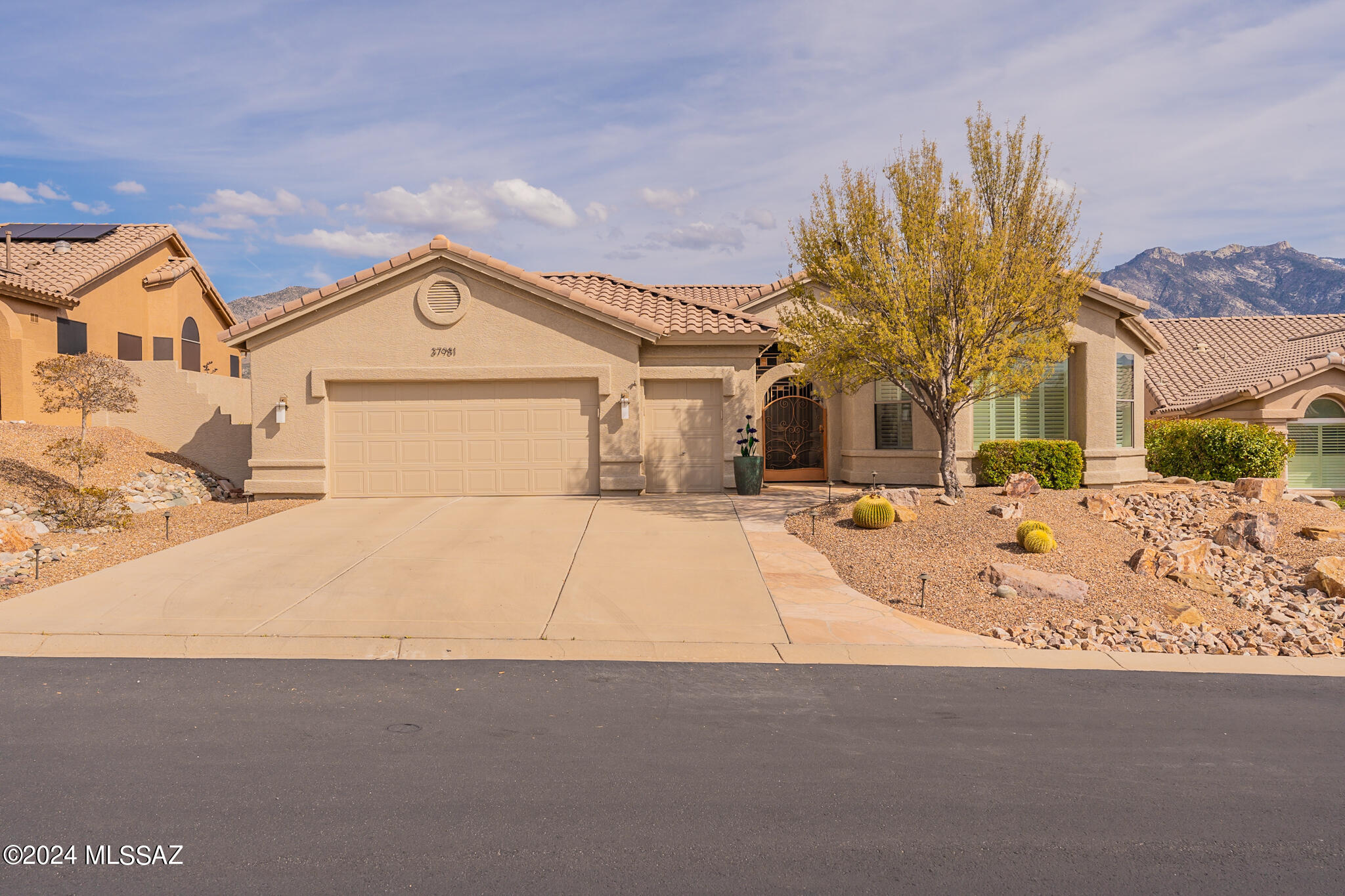 Immerse yourself in the breathtaking beauty of unobstructed panoramic mountain vistas, as you step into this meticulously updated Cambria model home nestled in the picturesque community of SaddleBrooke.
Upon entering, you are greeted by spacious living and dining areas that beckon to host gatherings and celebrations.  The heart of the home lies in its upgraded kitchen, boasting ample cabinet and countertop space, catering to both culinary enthusiasts and those who appreciate the convenience of a well-appointed cooking space.
In the owner's sanctuary, a cozy sitting area awaits, in the backdrop of majestic mountain views. The ensuite bathroom features a dual vanity, a custom shower, and a generous walk-in closet, providing a haven of relaxation and rejuvenation. Accommodating family and guests is effortless with two thoughtfully designed guest bedrooms complemented by a shared well-appointed bath. Additionally, a separate casita with its own bath ensures privacy and comfort for visitors.
Completing the home is a 2-1/2 car garage, providing ample storage space for vehicles and belongings, while also accommodating hobbies and projects.
Step outside to discover the true essence of Arizona living, as you are greeted by the captivating vistas from the covered and expanded patio/ramada. Whether savoring your morning coffee or basking in the glow of a mesmerizing sunset, this outdoor oasis offers an unparalleled setting to embrace the SaddleBrooke lifestyle.
Experience the allure of resort-style living amidst the natural splendor of the Sonoran Desert.  Indulge in the vibrant community atmosphere and array of amenities that define the SaddleBrooke experience, where every day presents an opportunity for adventure, relaxation, and connection.