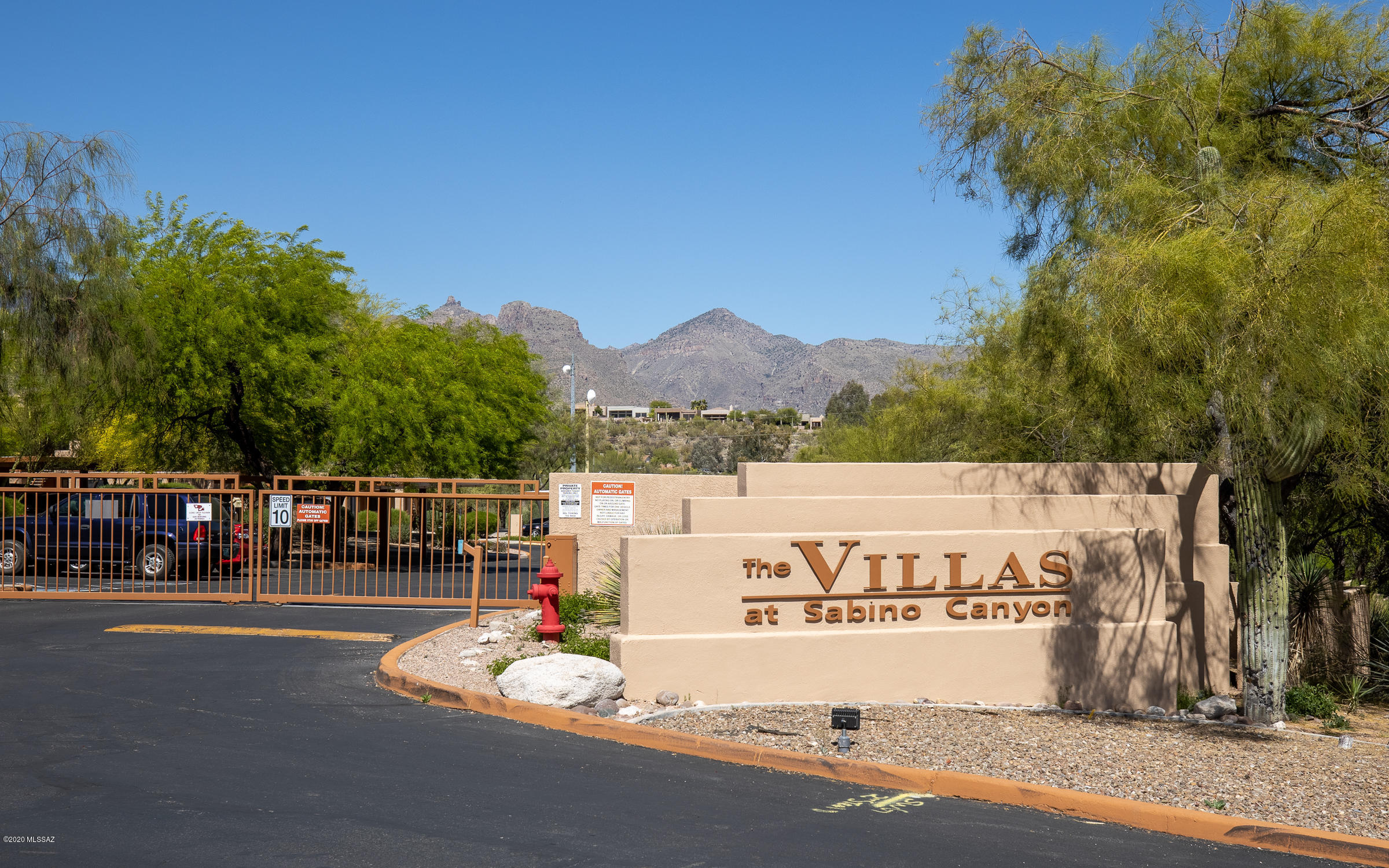 Lovely 2nd floor unit in the desired gated community of Villas at Sabino Canyon. Catalina mountain views, an open floor plan, new flooring with lots of natural light. New AC/Furnace .  New washer and Dryer . New water heater , new dishwasher and new garbage dispossal.  Community amenities such as pool, spa, and exercise facilities. POOL IS HEATED FROM NOVEMBER TO FEBRUARY . The HOA includes water, sewer, trash, pest/termite control and roof. Close to shops, restaurants, and hiking trails. Please come take a look! Owner is foreign national.Owner occupied.