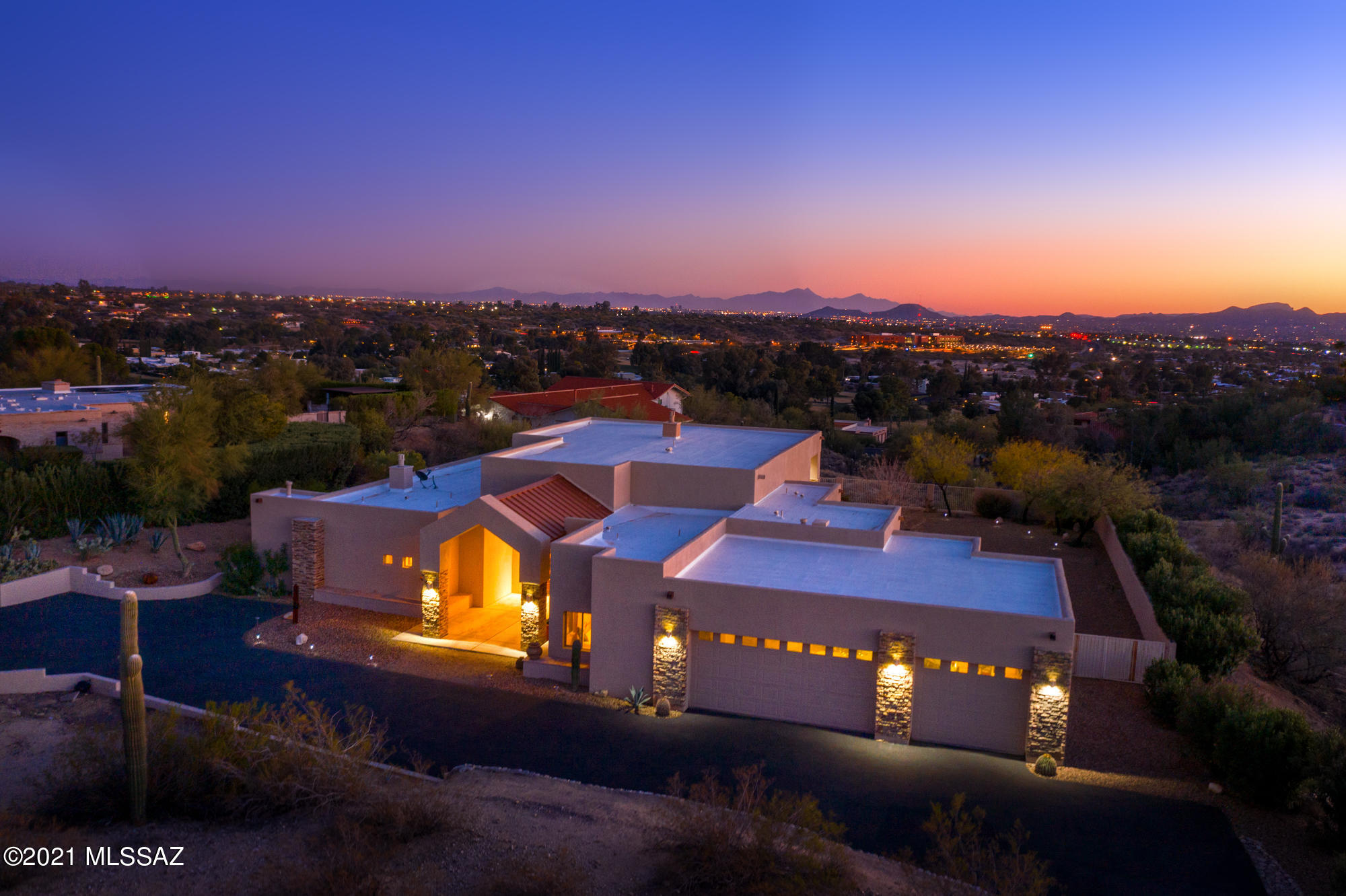 The newest home on Omni Tucson National Resort & Country Club is an astonishing Custom Talavera Built home sitting on 1.6 acres in a gated community with 24 hr guard. This home comes equipped with 14' ceilings and wooden floors in the common areas as well as a stunning floor to ceiling window system in the rear as you view out from your hill top to the panoramic cityscape view in the distance. Panoramic fireplace in the common area and one near the spa tub will surely allow you relax in your new home. In the kitchen you have beautiful Copenhagen cabinetry with a walk in pantry, wet bar, stainless steel appliances & in-counter gourmet range with kitchen nook. Energy efficient home with upgraded insulation and concrete filled block walls. Recent 1 yr old AC & recoated roof. Owner Occupie