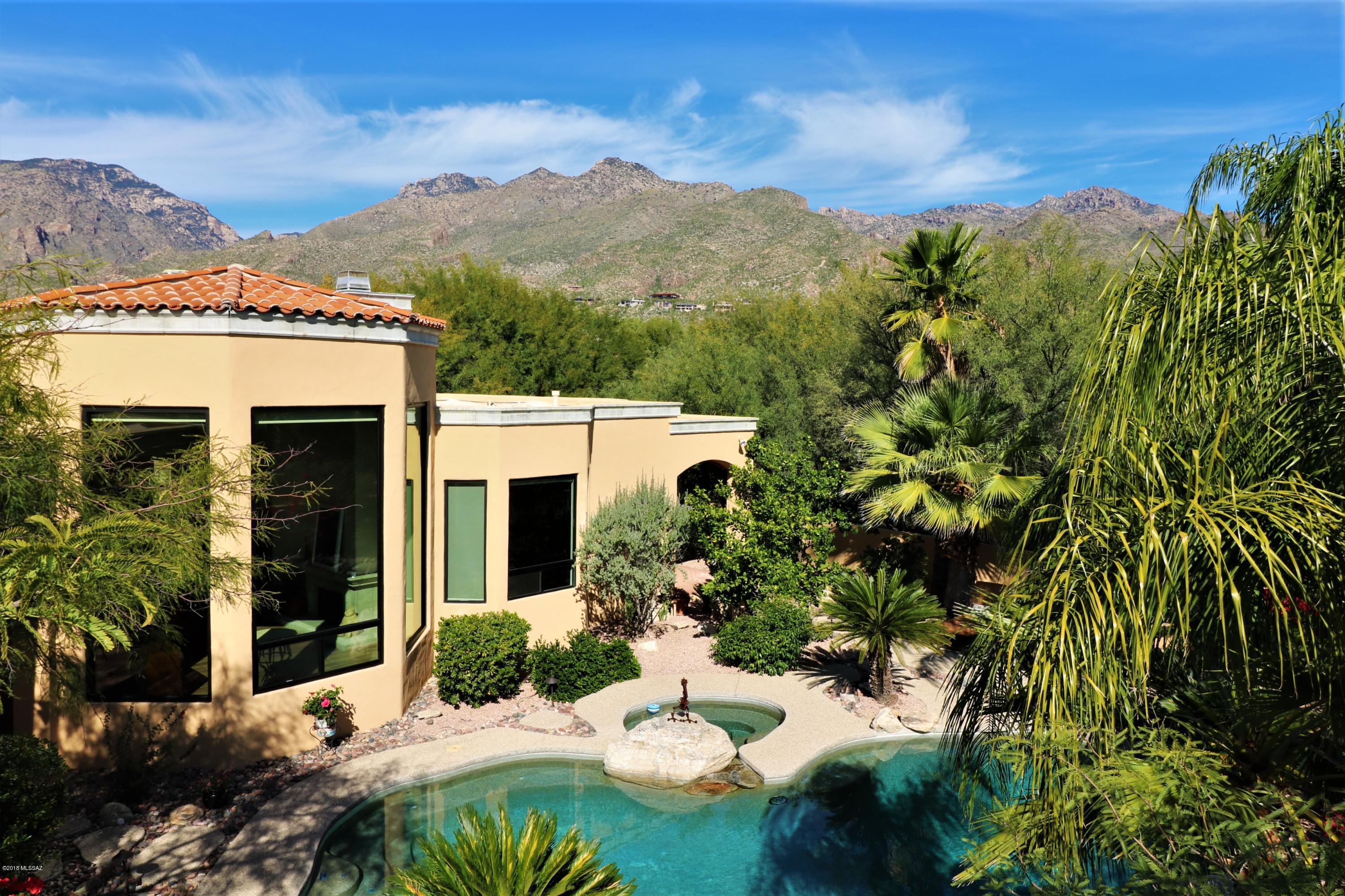 This elegant Mediterranean style home in a gorgeous resort like setting has been renovated throughout using contemporary design choices that complement the homes open floor plan and soaring ceilings. This homes many features inc. Canterra stone fireplaces, coffered ceilings, french doors, huge floor to ceiling picture windows & porcelain plank floor tile. Kitchen w/ custom hickory cab's, quartz counters, Subzero frig,, dual dishwashers, Wolf cooktop,,Viking oven/microwave. Master bedroom en suite w/glass shower enclosure, Voce freestanding tub & dual ceramic vessel sinks. The backyard is a tropical paradise w/ lagoon-like pool & spa, prof. landscaped with a variety of palm trees/flowering shrub/native plants and hardwired w/ LED landscape lighting.Don't miss out on this exquisite property!