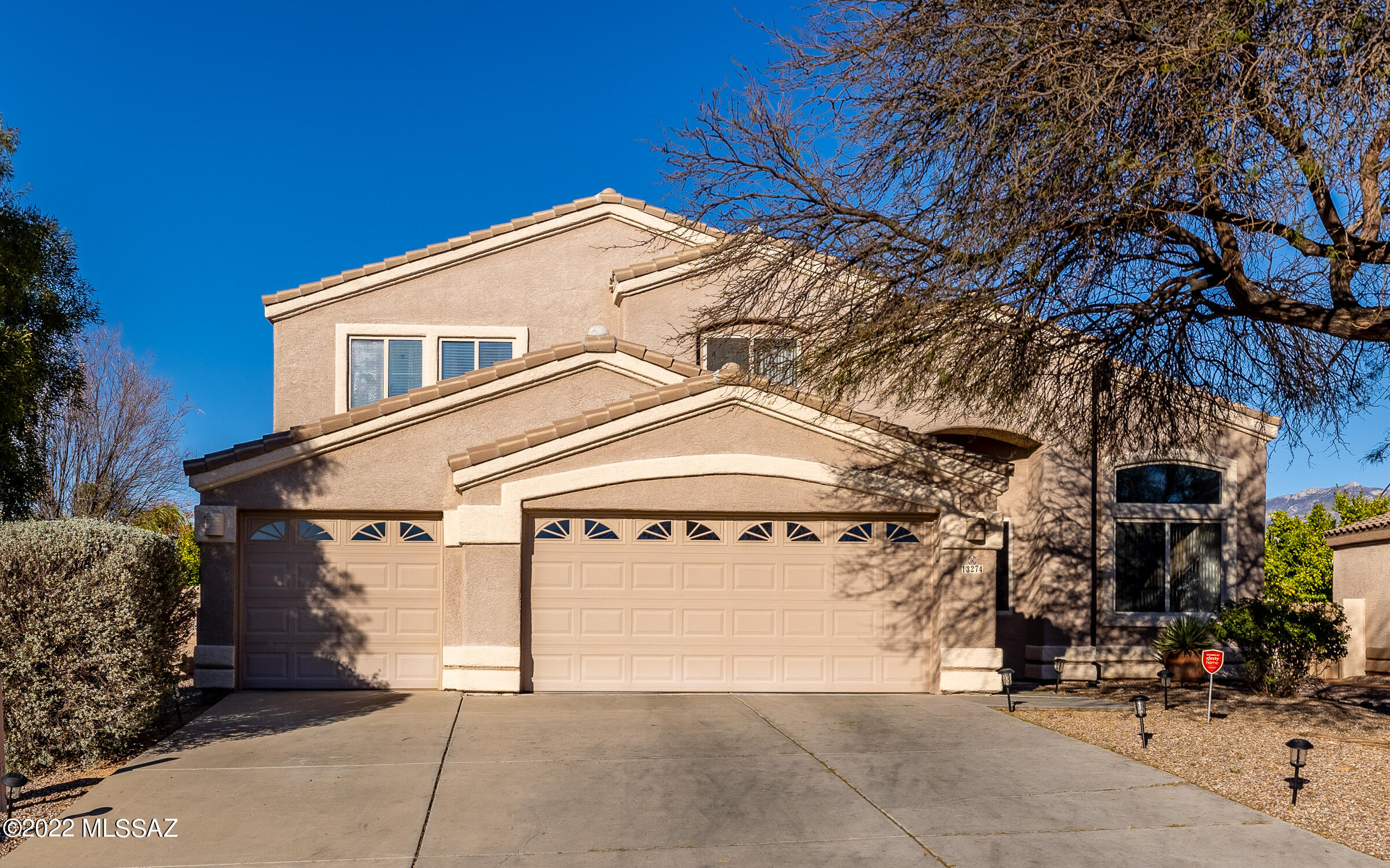 Sophistication meets necessity in this perfectly executed 5 bedroom, 3 bath, 3 car garage Rancho Vistoso Home. You'll love its large mountain view lot, tile roof, grand entry, soaring ceilings & gorgeous wood-look tile throughout the entire downstairs! The DOWNSTAIRS primary bedroom is outfitted w/a rear yard walkout, stunning spa-like bath w/separate vanities, soaking tub, separate walk-in shower, & a closet w/built-in cabinetry/shelving. The home has several living areas including an enormous upstairs loft w/a patio walkout. The kitchen is sure to please w/granite counters, gas range, stainless steel appliances, island w/elegant glass cabinetry, tile backsplash, recessed & undermount lighting AND a view to the back yard pool, spa & built-in BBQ island. SEE UPGRADE SHEET & WATCH VIDEO!!