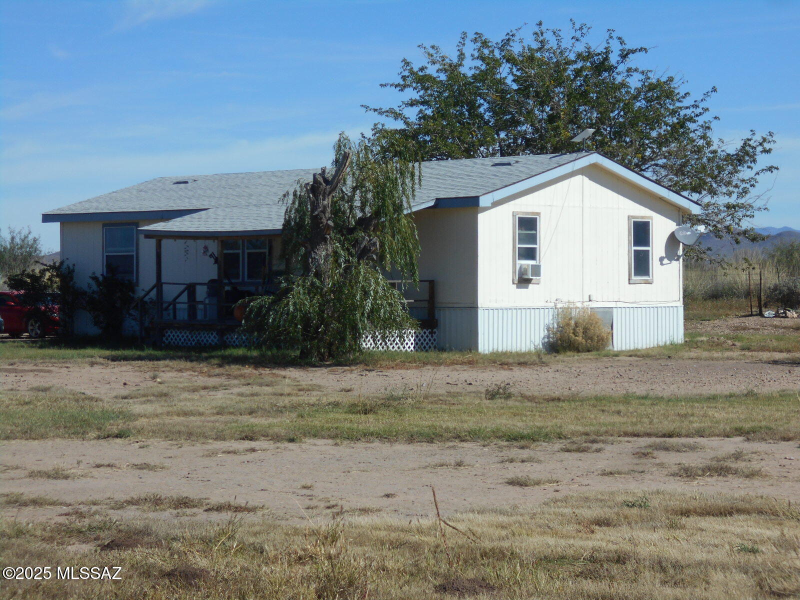 HUGE PRICE REDUCTION!!! Here's an opportunity to fulfill your dream of having a home in the country with lots of elbow room, wildlife galore, and dark night skies for stargazing! This manufactured home, sits on the eastern edge of 30 acres, with a beautiful view of the Swisshelm Mountains to the east. Enjoy the rural lifestyle you've dreamed about, with a short drive to the conveniences of the small town of Elfrida. There's plenty of room to raise animals on this fenced 30 acres, and there's a shade structure and some pens in the pasture for your critters. Don't wait too long on this one!