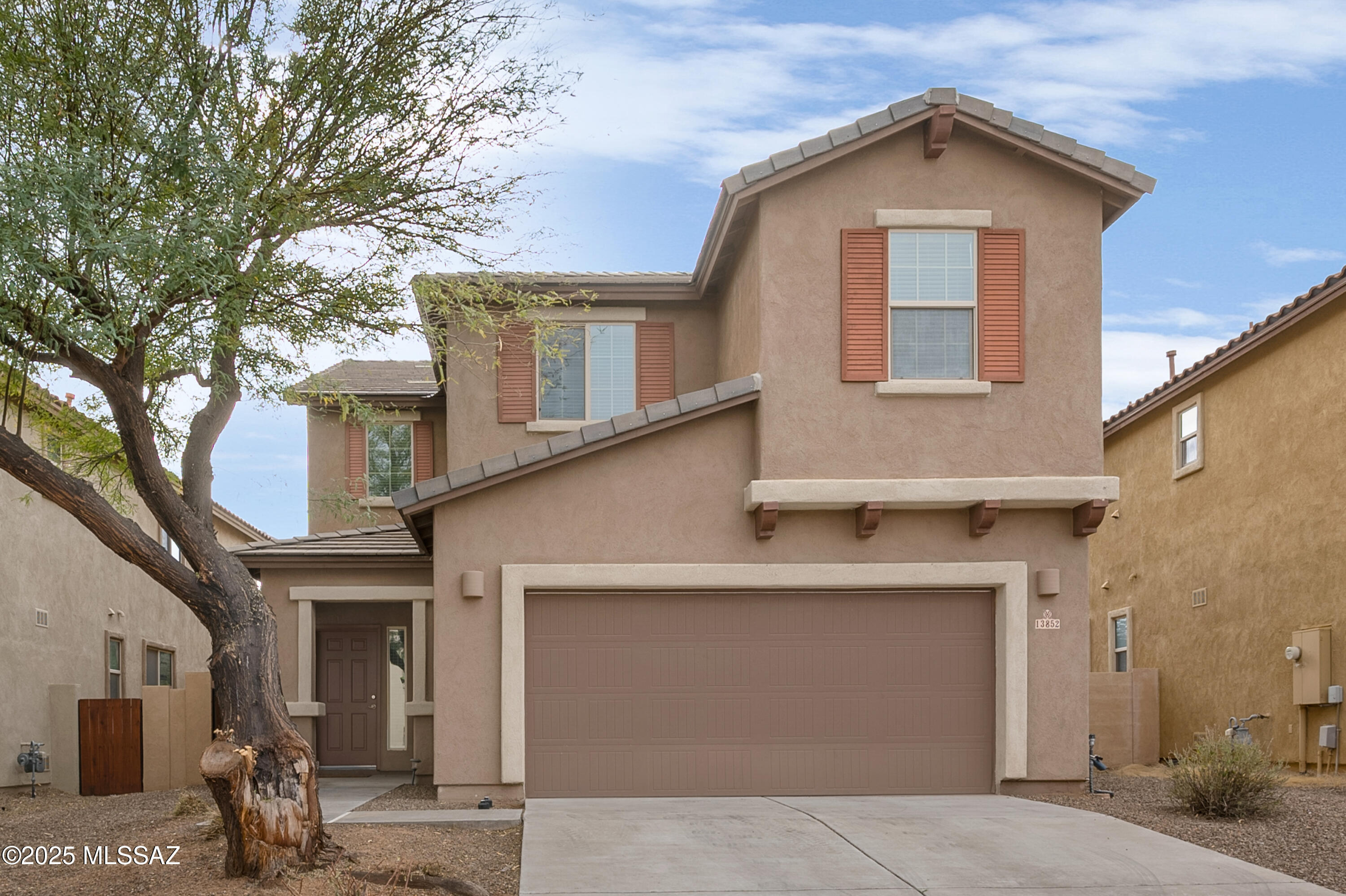 Beautiful 4-bedroom, 3-bath home in desirable Rancho Sahuarita! This move-in-ready home has it all — fresh interior paint, brand-new carpet, & plenty of space for comfortable living. The open great room concept flows into a stunning kitchen featuring dark cabinets, gorgeous countertops, stainless steel appliances, & a large breakfast bar. The ground floor includes a versatile den/home office, while upstairs you'll find all bedrooms plus a spacious bonus loft. Grand primary suite offers a walk-in closet, dual vanity, garden tub, & separate shower. Additional highlights include upgraded lighting, ceiling fans throughout, brick-paver backyard, & 2-car garage. Enjoy all the incredible amenities Rancho Sahuarita has to offer including a community pool, fitness center, basketball, putting gree