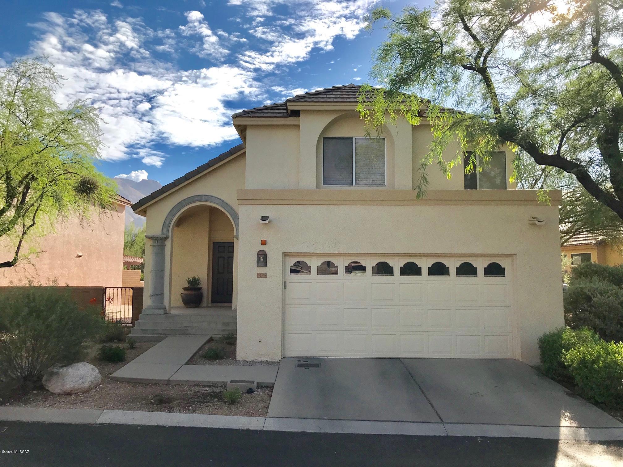 Foothill living located in gated La Paloma. Beautiful home w N facing backyard w natural desert behind & stunning Catalina Mountain views. Wake up & enjoy the local Cardinal Family & a variety of southwestern birds as the sun rises to the east. Family room with vaulted ceilings is adjacent to the kitchen w access to backyard patio for our indoor/outdoor lifestyle Picturesque windows enhance the bright and airy feel of the home along with a wood burning stove for our chilly winter evenings. Three spacious bedrooms w large walk in closets. Master bedroom faces north with the best views of the Catalina Mtns and Desert Fauna. Move-in ready and perfect as either year round or second home. HOA includes Manned Gate, front landscaping, waste management, community pool
