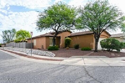 CHARMING  3 bedroom 2 bath home with 2 car garage built in 2004.  SITED on private corner lot. Beautifully maintained!   Open spacious living areas, lots of tile floors, tile roof, breakfast bar that opens from kitchen to living area.  Large dine- in kitchen, pantry,  stainless steel appliances (new microwave). Ceiling fans throughout.  Washer/dryer new 2022, all appliances convey.  Exterior of home painted 2023.  A/C in under maintenance contract (new 2017) North facing patio and covered porch, mountain views. Seller can accommodate 2-3 week occupancy and home will be professionally detailed.