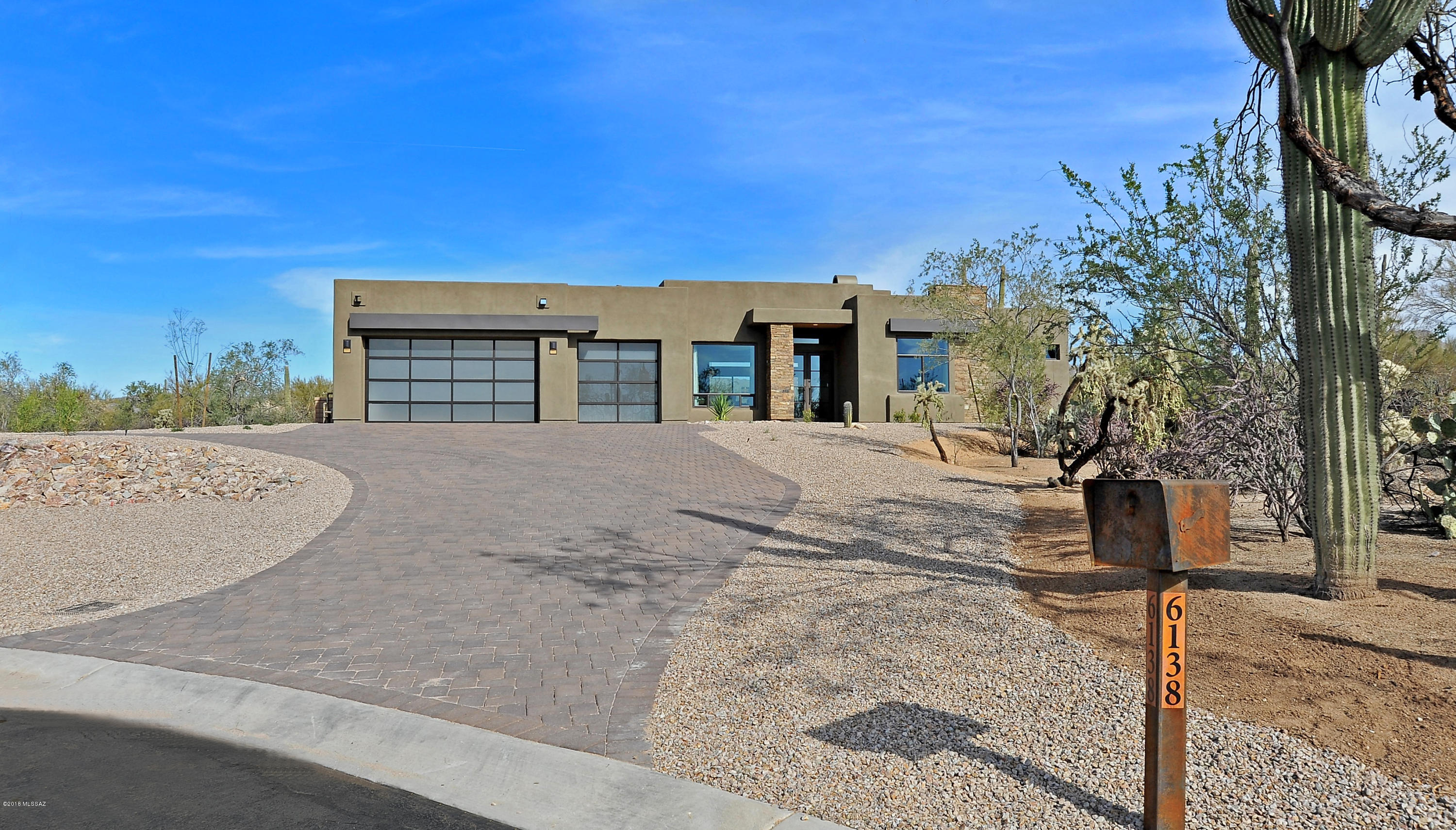 MODEL LEASE-BACK This magnificent A.F. Sterling model home on 2.7 acres in a gated community with sensational mountain views and stunning high end finishes through out the home. The exquisite Great Room with 14' high ceiling, linear fireplace and a 16' sliding glass door that opens to the patio creating indoor/outdoor living space. The beautiful gourmet kitchen with fabulous features that include a kitchen island with a waterfall countertop, quartz countertops, double ovens, microwave, cooktop and refrigerator. All in-suite bathrooms  vanities are quartz and granite vanity in the powder room. Fabulous backyard with a built-in BBQ and firepit.