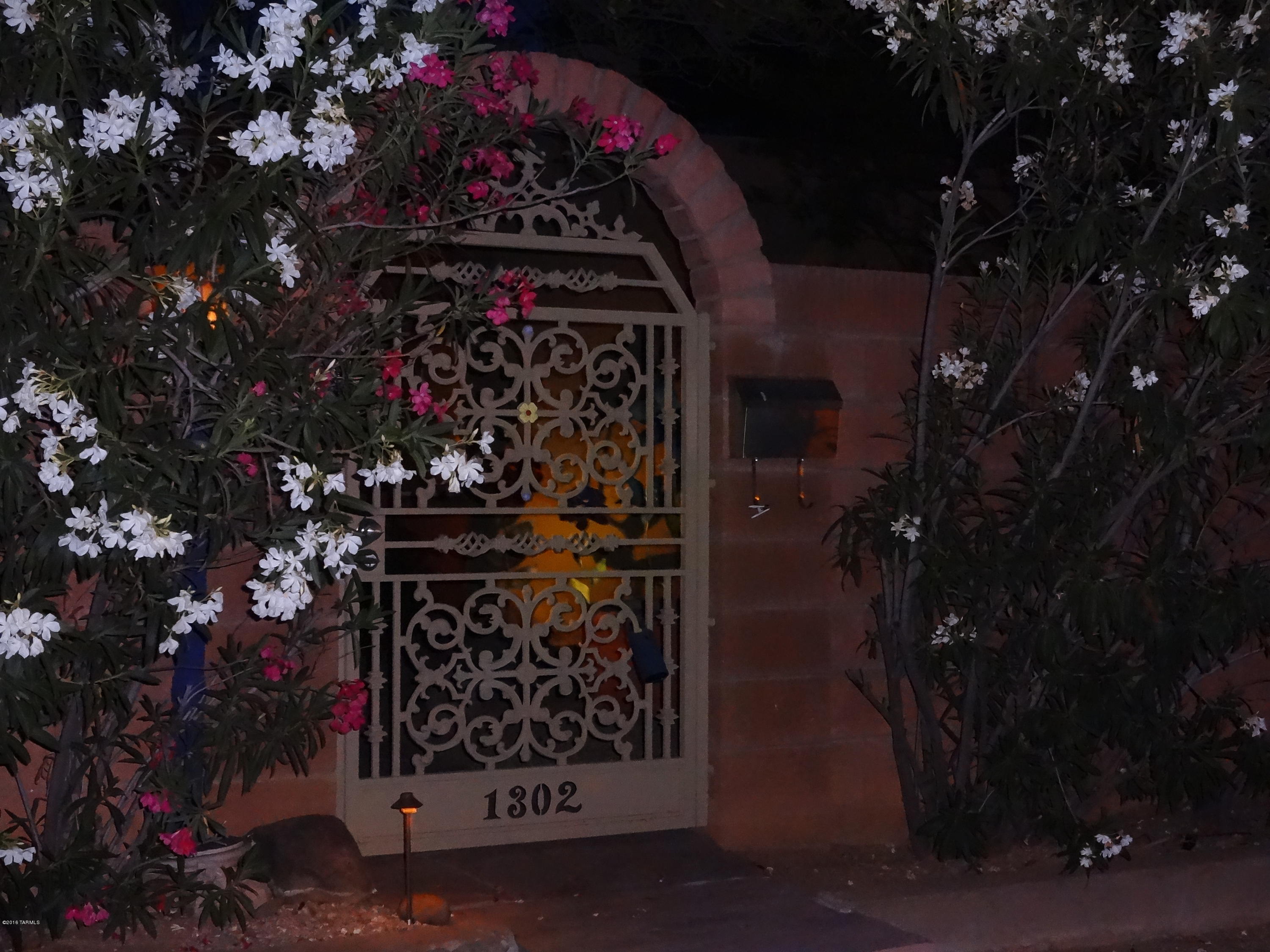 This renovated historic home located in Central Tucson, boasts pride of ownership.Enter through the front decorative iron gate into the soothing sound of water creating a peaceful respite.Open the door to the main house and your breath is taken away by the beauty of the partially wooden cathedral ceiling,double pane windows,and saltillo tile throughout. As you continue you will enter the custom kitchen which has all stainless steel appliances and an island made of indian marble with maple cabinetry. Open the oversized sliding doors and step out to the covered patio into the garden that was featured in Phoenix Home&Garden in 2013.There you will smell the herbs and lavender while being shaded by mesquite and palo verde trees.The guesthouse features 2  bedrooms 1 bath,kitchen,and laundry room