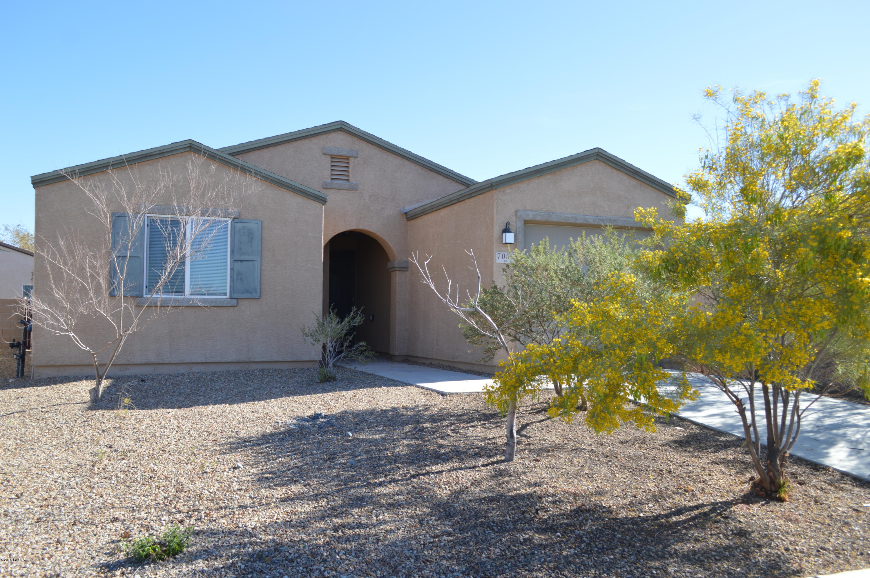 Don’t miss out on this charming 2bd/2ba home in popular Rancho Valencia!  Open floor plan with light and bright great room, brand new neutral carpet and lots of windows throughout. Versatile kitchen featuring nice oak cabinetry, black appliances, SS fridge and brand new garbage disposal!  Large pantry/laundry room area with tons of storage space and newer washer & dryer. Nice master with walk-in shower and large walk-in closet. This home is conveniently located across the street from one of the many community parks in the area!  The neighborhood hosts several walking/jogging paths, basketball courts, sand volleyball, jungle gyms & covered picnic areas. Won’t last long!  Within Minutes of DMAFB, Raytheon, I-10, Downtown, Shopping and Schools!