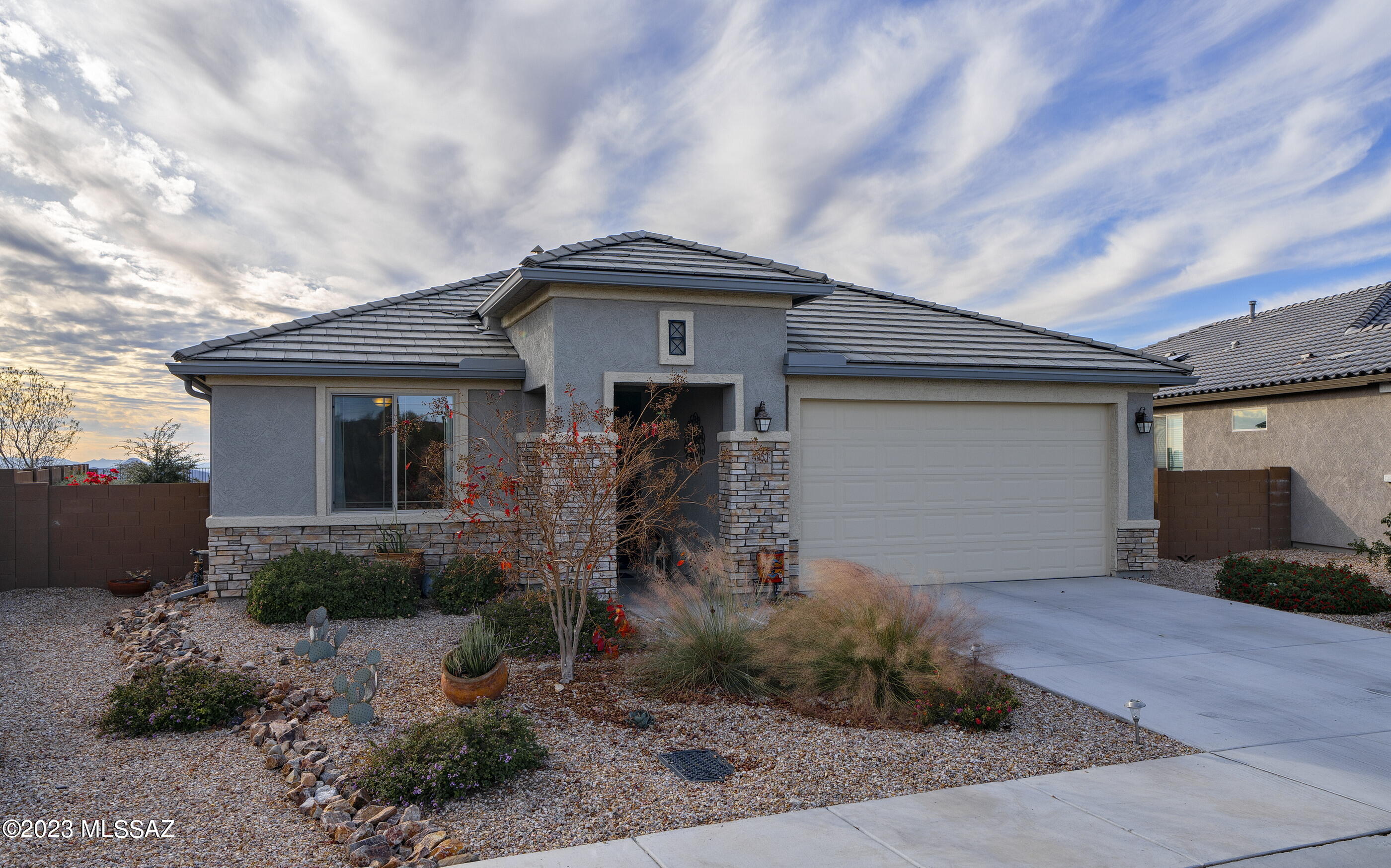 Immaculate home with stunning panoramic sunset views located in the very sought-after gated community of Tangerine Ridge. This 1,992 square feet home features gorgeous quartz countertops, a great open-concept floor plan with 3 spacious bedrooms, 2 full baths, a tandem garage, and tons of storage space. Enjoy breathtaking views of the Catalina mountains from the front office, or relax after a long day in your serene backyard with an open desert, mountain views, and a custom viewing fence. Close to hiking trails, Tangerine Sky park, Ritz Carlton Dove Mountain, shopping, dining, golf, and more.