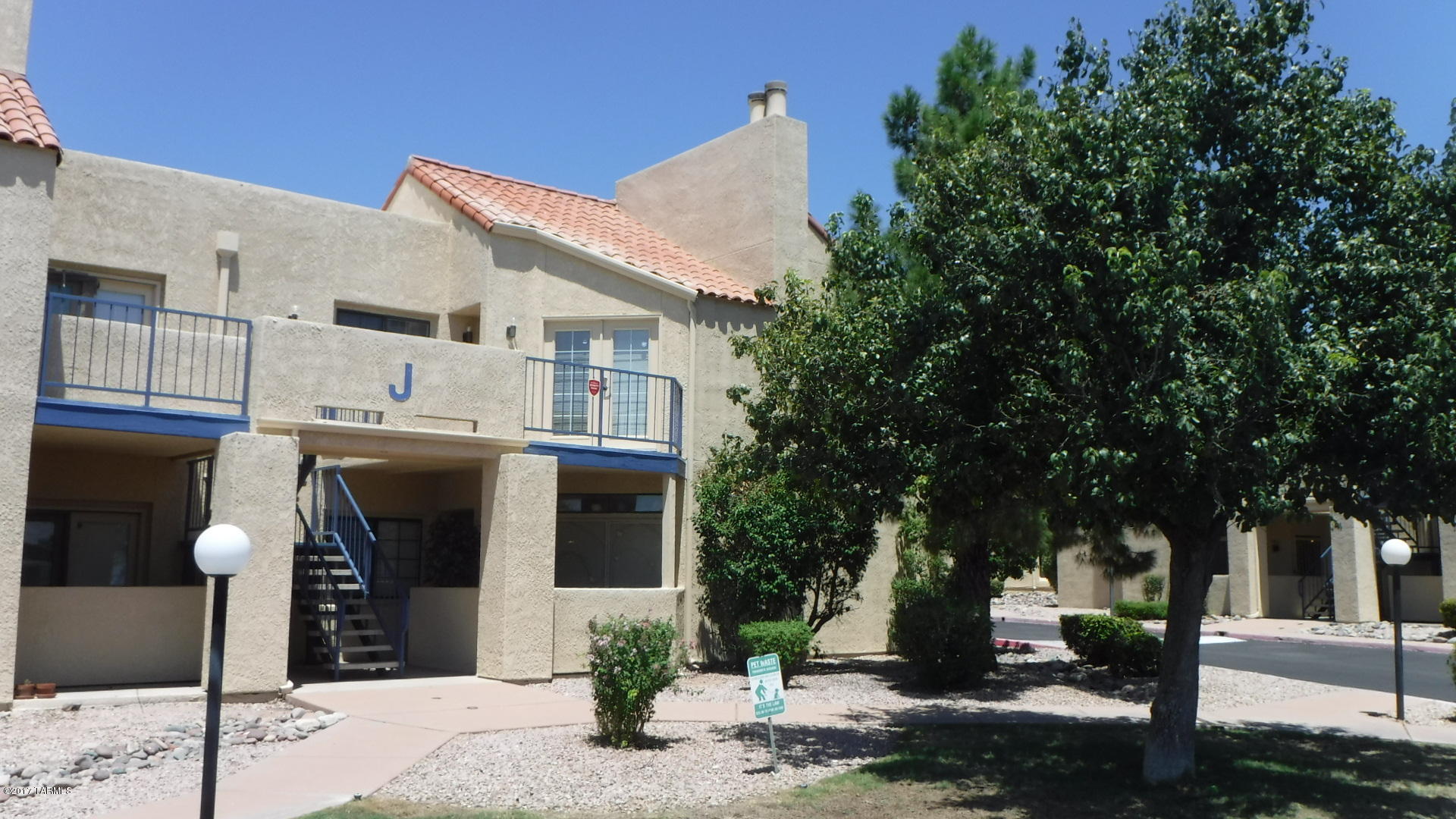 Luxury 2 BR, 2 BA upstairs condo for sale at the beautiful 1200 River complex. BRAND NEW A/C SYSTEM JUST INSTALLED!!! Balcony with great views & a fire place in the living room. Kitchen includes a flattop electric stove, refrigerator, dishwasher and microwave. Washer/dryer also included.  New carpet. Association boasts a heated pool and spa, racquetball court, work out room with sauna, recreation room next to pool.  Rear exit to the Rillito River Walk to the south.  Close to U of A. One covered parking spot and lots of uncovered public spots.