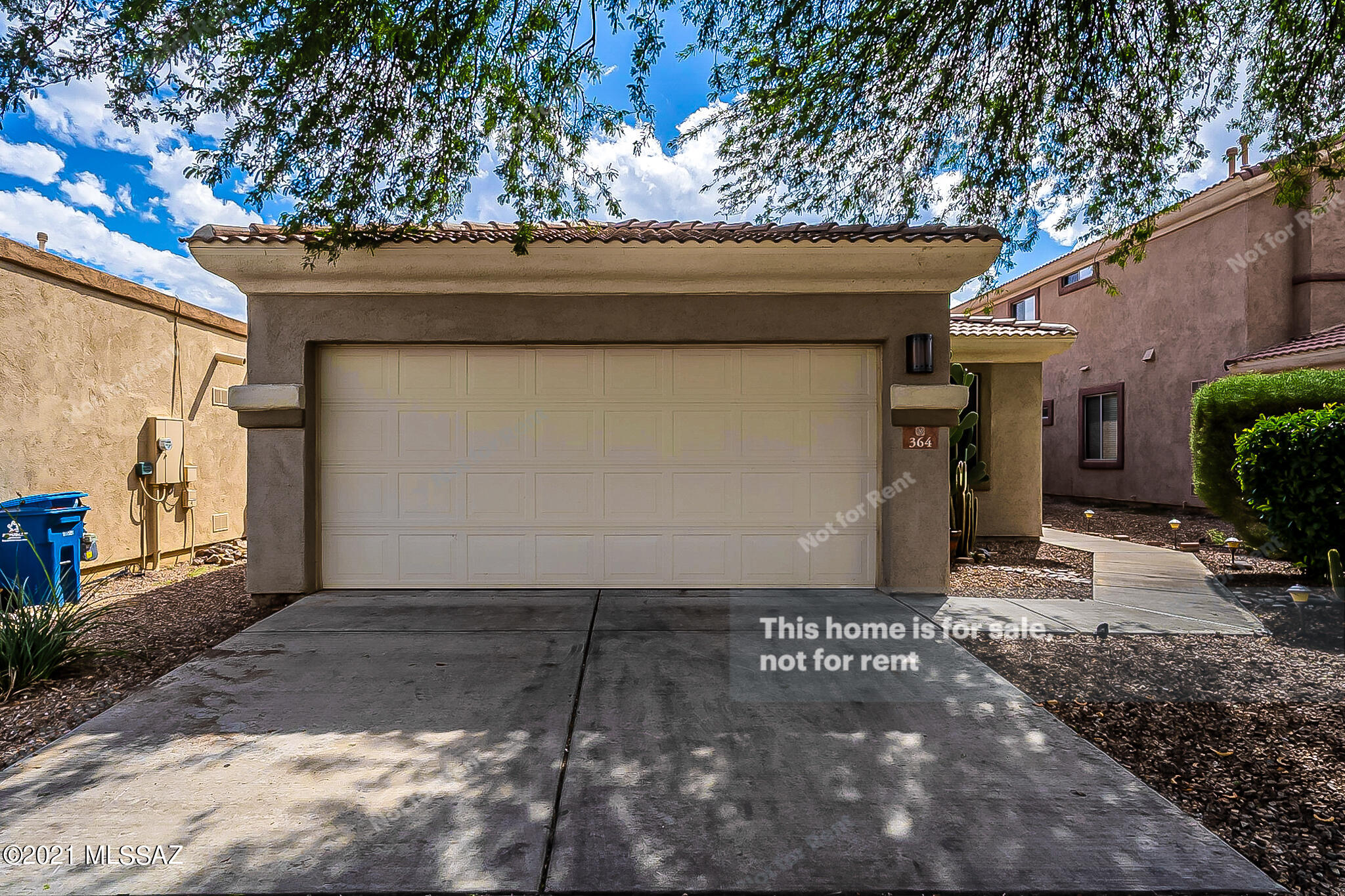 This Sahuarita one-story home offers a patio, and a two-car garage.