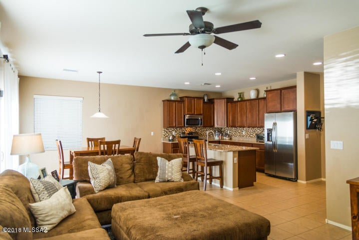 This gorgeous home in the unique gated community of Sky Ranch, with views of the desert, mountains and breathtaking sunsets is a must see and a must have! With a one of a kind backyard offering resort like living which includes a custom pool, Travertine pavers, fire pit and turf. The gourmet kitchen has stainless steel appliances, granite countertops, cherry cabinets and upgraded tile. This is truly an amazing home!