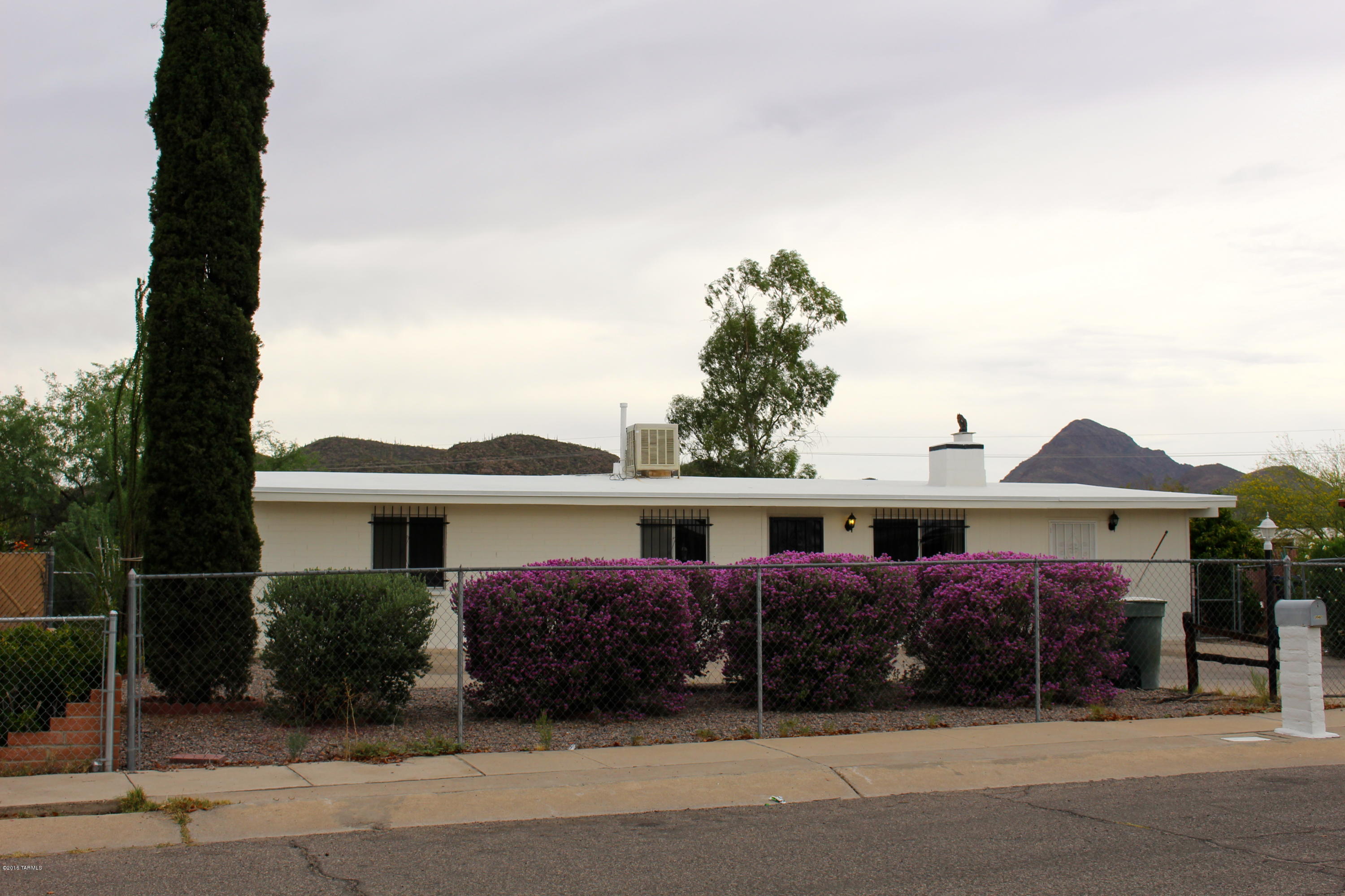 Bring the whole family to see this move in ready gem!  There's room for everyone in this 4 bed 2 bath with a den and a very large screened in porch.  Room for three cars behind your gated front parking area with additional room on the street.  The master bedroom is a true retreat with large sleeping area, separate sitting room, and access to the back patio.  Ample back yard for kids, pets, and family with views of mountains from all over the property.  New carpet, paint, and other upgrades await you.  Welcome home!