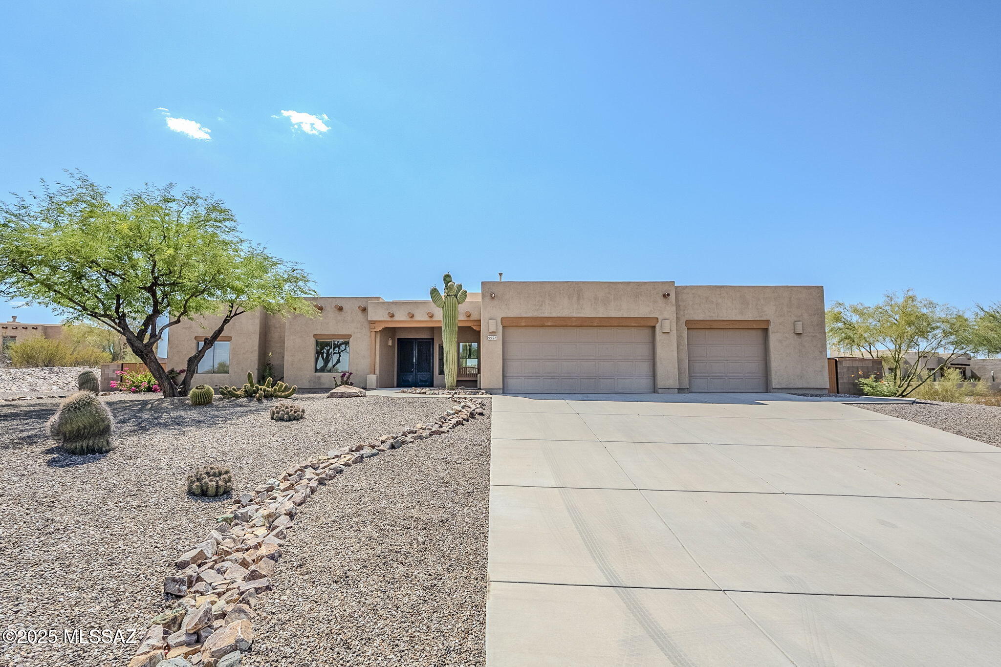 Stunning 5BD/3BA semi-custom home on 1.29 acres,  3,720 sq ft with open floor plan, huge great room, and gourmet kitchen. All bedrooms feature walk-in closets. Separate suite with wet bar has private entrance—ideal for multigenerational families , office, or theater room. Includes 3-car garage, soft water, owned solar panels that convey, manicured landscaping, extra land beyond fence, and mountain views. Peaceful setting surrounded by like homes. A rare blend of space, privacy, and versatility.