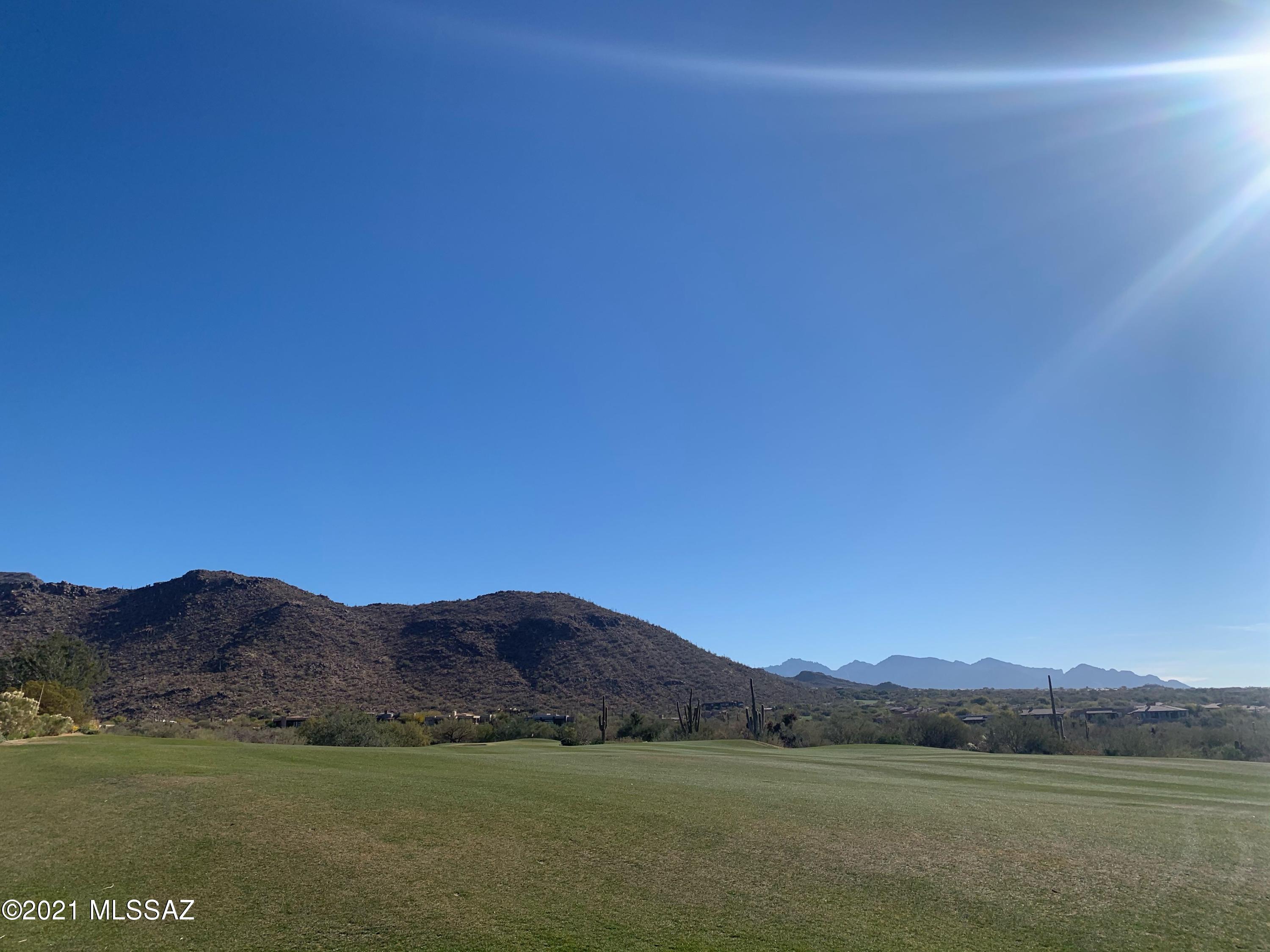Welcome to The Residences at The Ritz-Carlton, Dove Mountain. Stunning homesite overlooks the third fairway of the The Wild Burro Nine, with views of four mountain ranges and city lights.