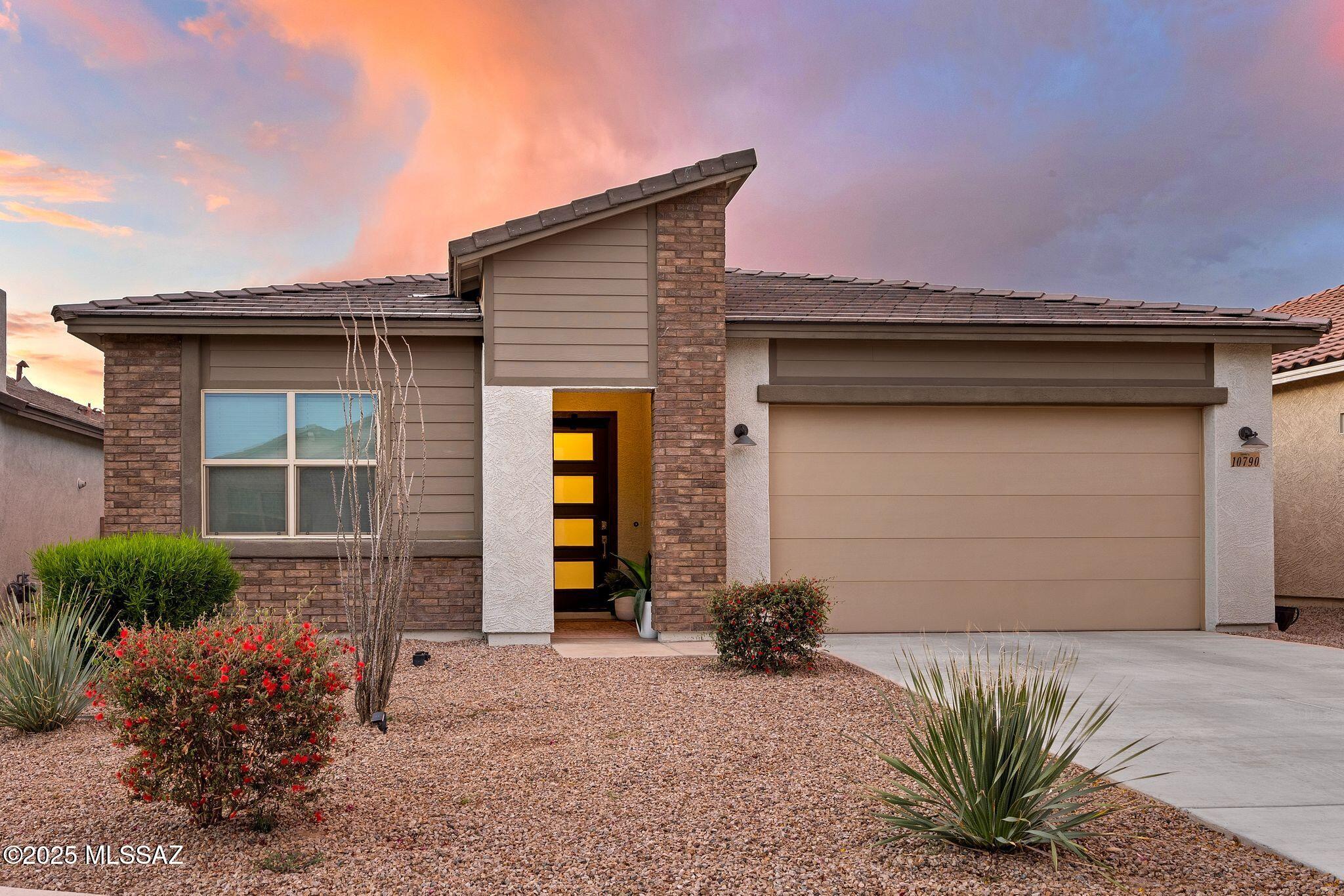 Why wait for new construction when you can own this impeccably upgraded, almost new, turnkey home now? Fully Furnished & Move-In Ready in Gladden Farms! Built in 2022, this upgraded 3BR/2BA Azure floor plan features 10' ceilings, 8' doors & Travertine tile. The gourmet kitchen and both  bathrooms are upgraded. (See upgrade list) The spacious owner's suite offers patio access, a large walk-in shower, and huge walk-in closet. Enjoy a beautifully landscaped (irrigation system front & back with automatic timer). Backyard has low-maintenance plants and artificial grass. Plus, a tandem garage provides extra space for a third car, storage, or workshop.—far beyond what new construction offers. Skip the wait and move right in! Located near parks, trails, splash pad, and BBQ areas.