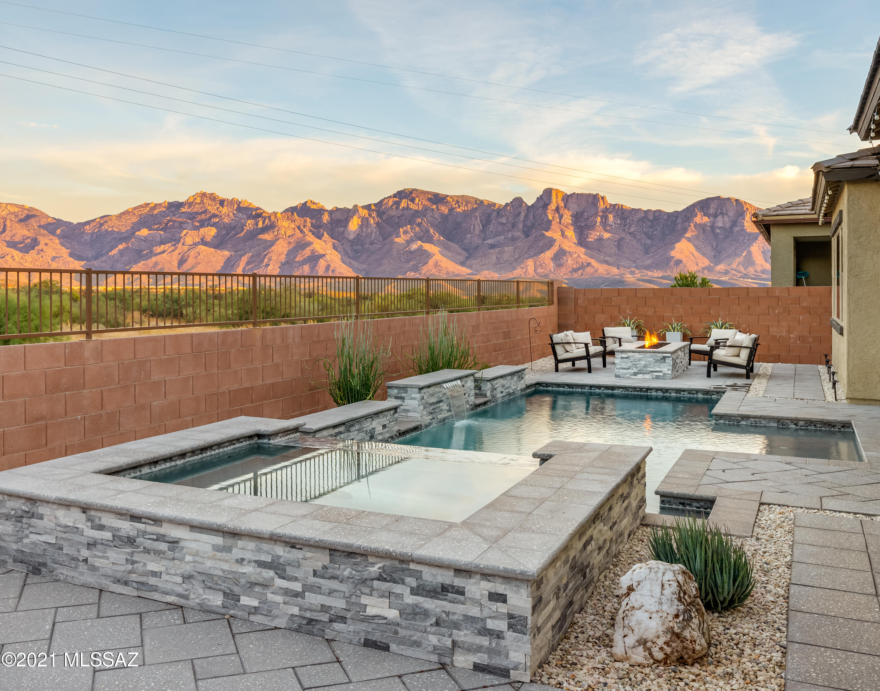 Spectacular unobstructed Panoramic Catalina Mountain View. Soft contemporary design w/simplicity, subtle sophistication & open floor plan. Sitting on premium lot in Gated Alterra at Vistoso Trails in Oro Valley, this Mattamy-built Summit model is just what you've been waiting for. Built in 2019 this newer energy efficient 2,751sf, 3BR, 2½BA+den home w/3-car garage & saltwater pool & spa is a perfect place to call home. Great room has 16' sliding glass door overlooking patio, pool, spa, firepit & mountain views. Kitchen has huge island/breakfast bar, stainless gourmet appliances, gas 5-burner cooktop, Cherry slate cabinets, granite counters & dining area. Master suite has large picture window, walk-in closet, Kohler garden tub, separate shower w/glass surround, split his/her vanity. Porcelain tile through except carpeted guest BRs. Garage floors are tiled. Post-tension foundation. Paver brick driveway.