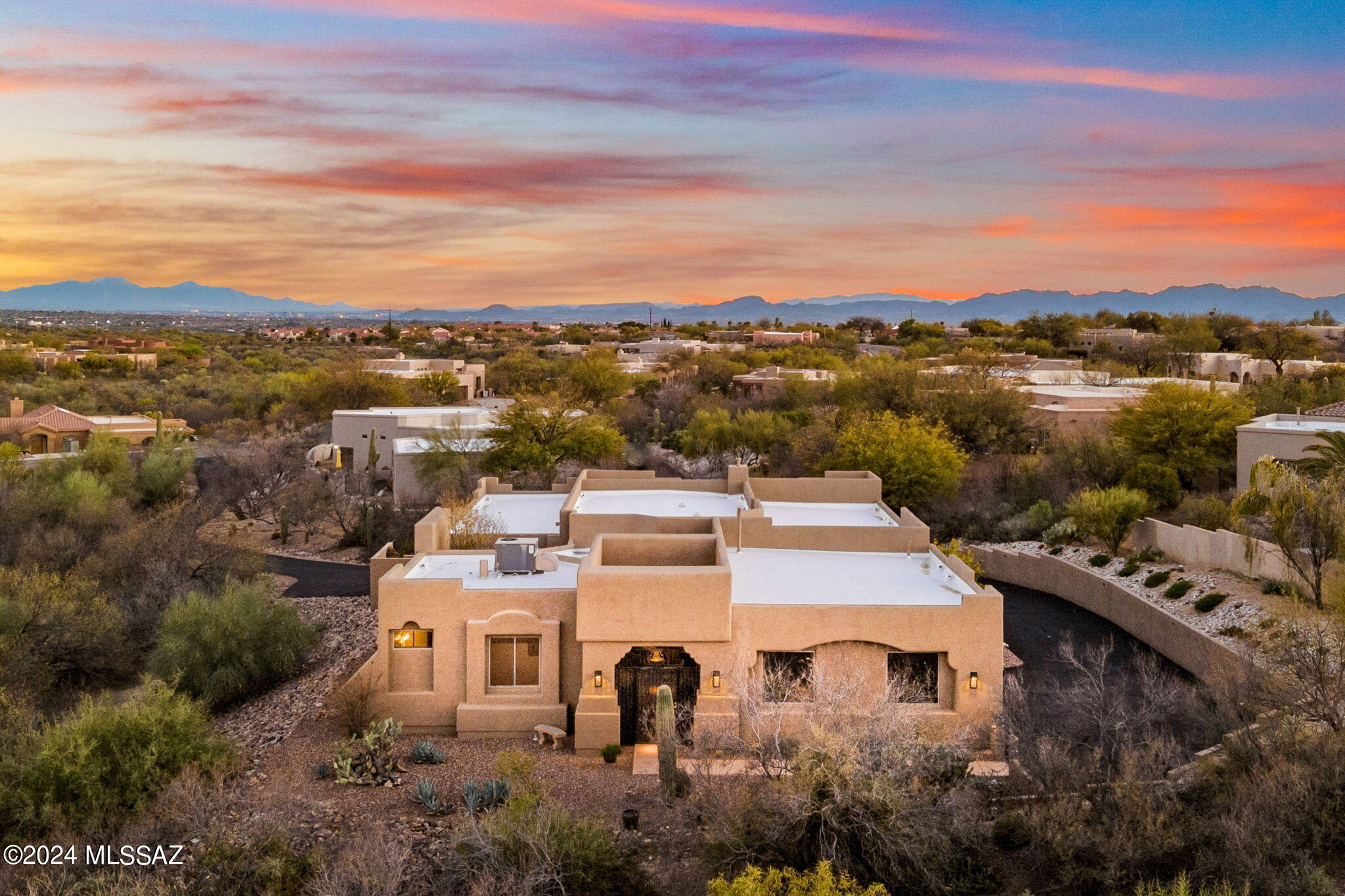 Nestled on a sprawling, private lot, this residence offers unparalleled privacy. A winding, tree-lined driveway leads to your secluded retreat. Impeccably maintained, the home features a well-thought-out functional floor plan. A hallmark of this property is the detached guest casita, ideal for guests or family. Step outside to discover your own oasis with a Pebble Tec pool and spa, perfect for relaxation and entertainment against the backdrop of majestic Pusch Ridge views. Welcome to your Oro Valley Oasis, where luxury meets privacy for your utmost comfort. Note: Viewings of this property are strictly by appointment only and after proper vetting.
