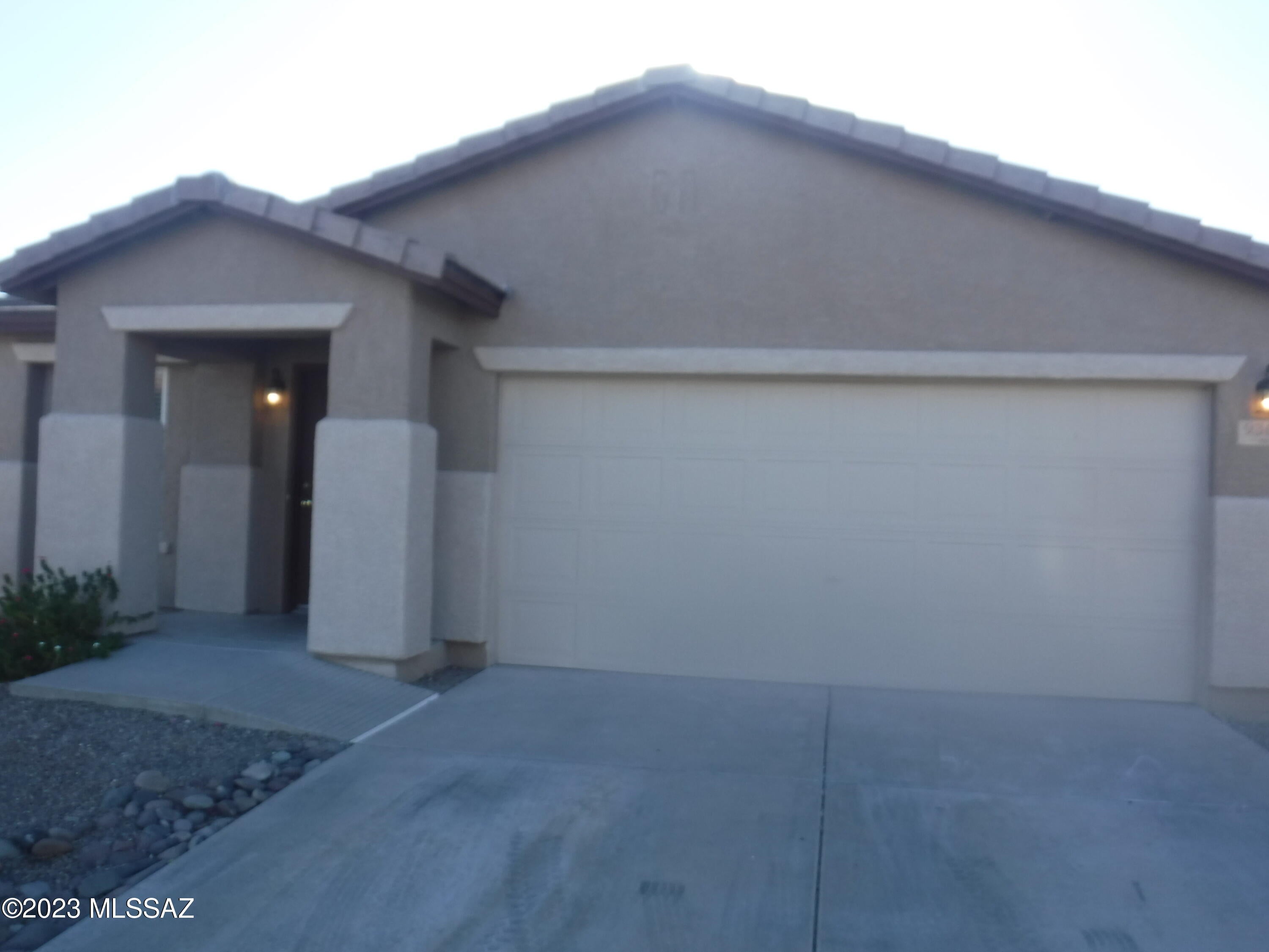MOVE IN READY! Amazing home ready for you! When you enter you see large living room leading back to county kitchen (microwave installed) including island / breakfast area and large family room. Main bedroom with walk in closet and big bathroom with double vanity is in the back corner of home. 2 additional bedrooms, bathroom and laundry room is in front of home with 2-car garage, plus auto opener, at upper corner. Ceiling fans plus newer paint one year ago. Newer carpet in bedrooms and ceramic tile in living areas. Nice landscaping and recent exterior paint. Newer HVAC system reduces electric bill and will keep you cool in our hot summers and warm in our mild winters. Roof recently serviced. Nice mountain views from front and rear of home.