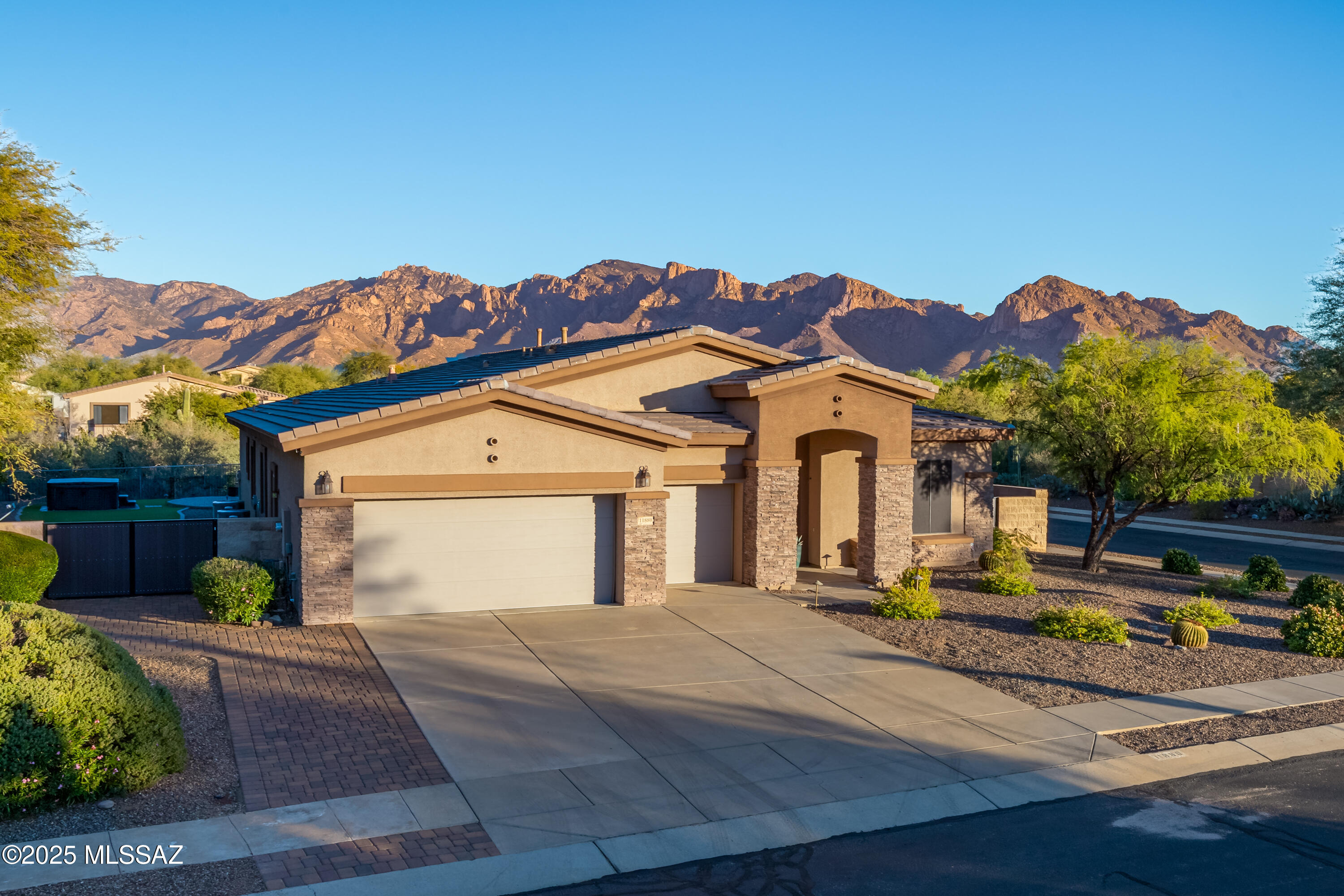 Beautifully Updated Home with 5 Bedrooms, 3 Full Bathrooms, 3.5 Car Garage and Unobstructed Catalina Mountain Views. Ceramic wood plank flooring throughout main house. Kitchen has upgraded cabinets, stainless steel appliances, gorgeous granite countertops and backsplash. Master Bedroom has oversized walk-in shower with remodeled master bathroom, large walk-in closet. Majestic Backyard has Pool and Hot Tub that overlooks the Catalina Mountain, Built-In BBQ and Bar Area. This home has it all!