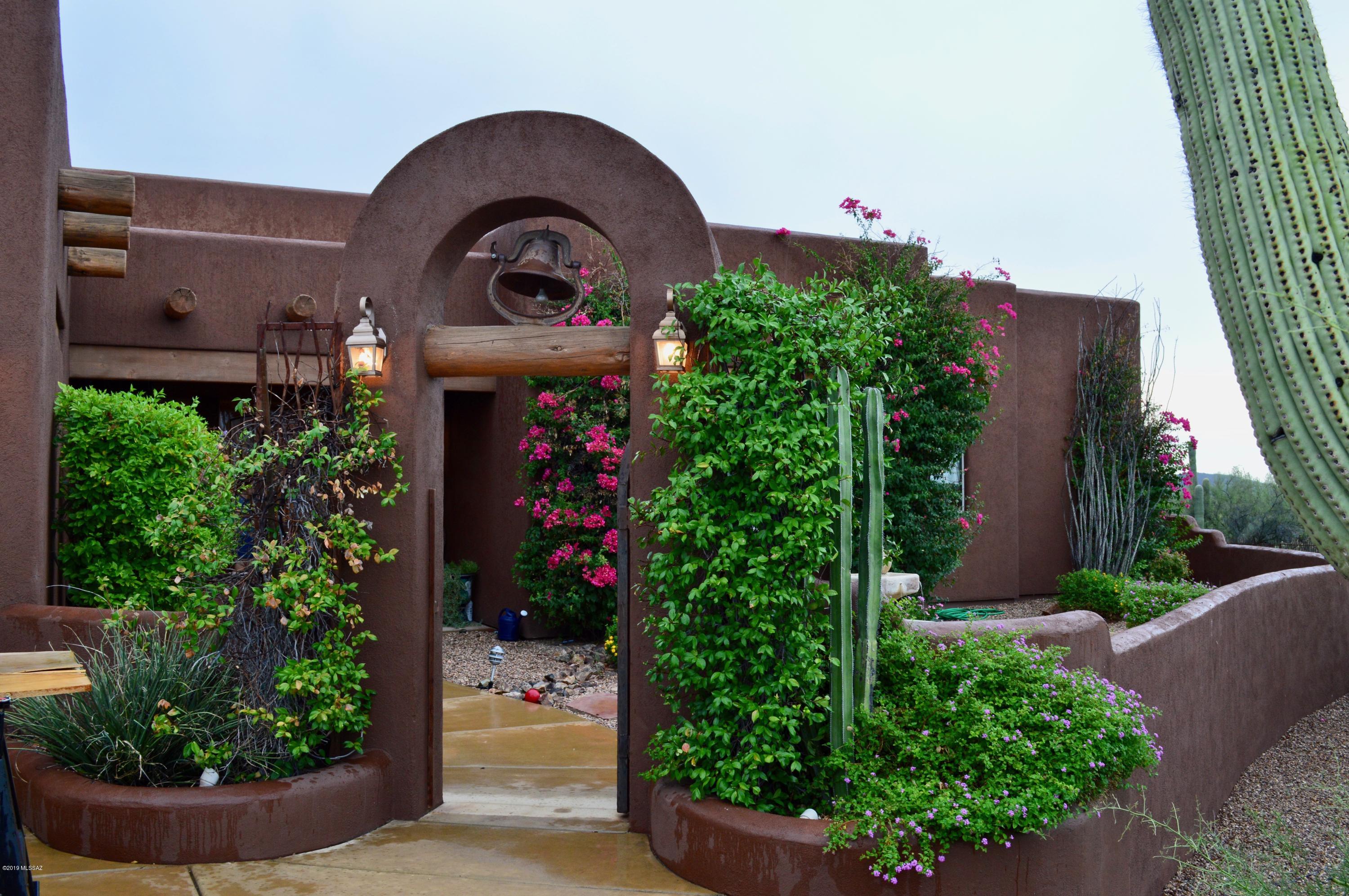 This 3.6 acre Southwestern style home is located on west Ina Road in Sombrero Shadows, a gated community rich with true southern Arizona beauty. Stepping into your new home will have you awestruck as you peer through your backyard oasis to majestic mountain views. Entertaining will be a breeze in this 3,855 square foot home with your built-in BBQ and salt water pool and spa. This open floor plan will give quick access to the granite countertops in your kitchen equipped with stainless steel appliances, hooded gas range and walk in pantry. Take a quiet evening in, sitting next to your second fireplace in your master bedroom which has a beautiful garden tub and a spacious walk-in closet.  Did we fail to mention the four car garage and full RV hookup on the side?  This is a must see home.